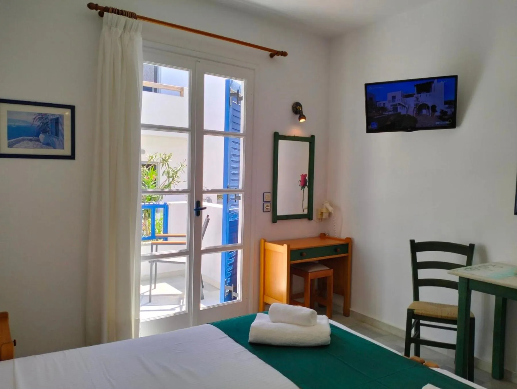 TV and multimedia, Bed in Nostos Studios at Saint George beach Agios Georgios Chora Naxos town