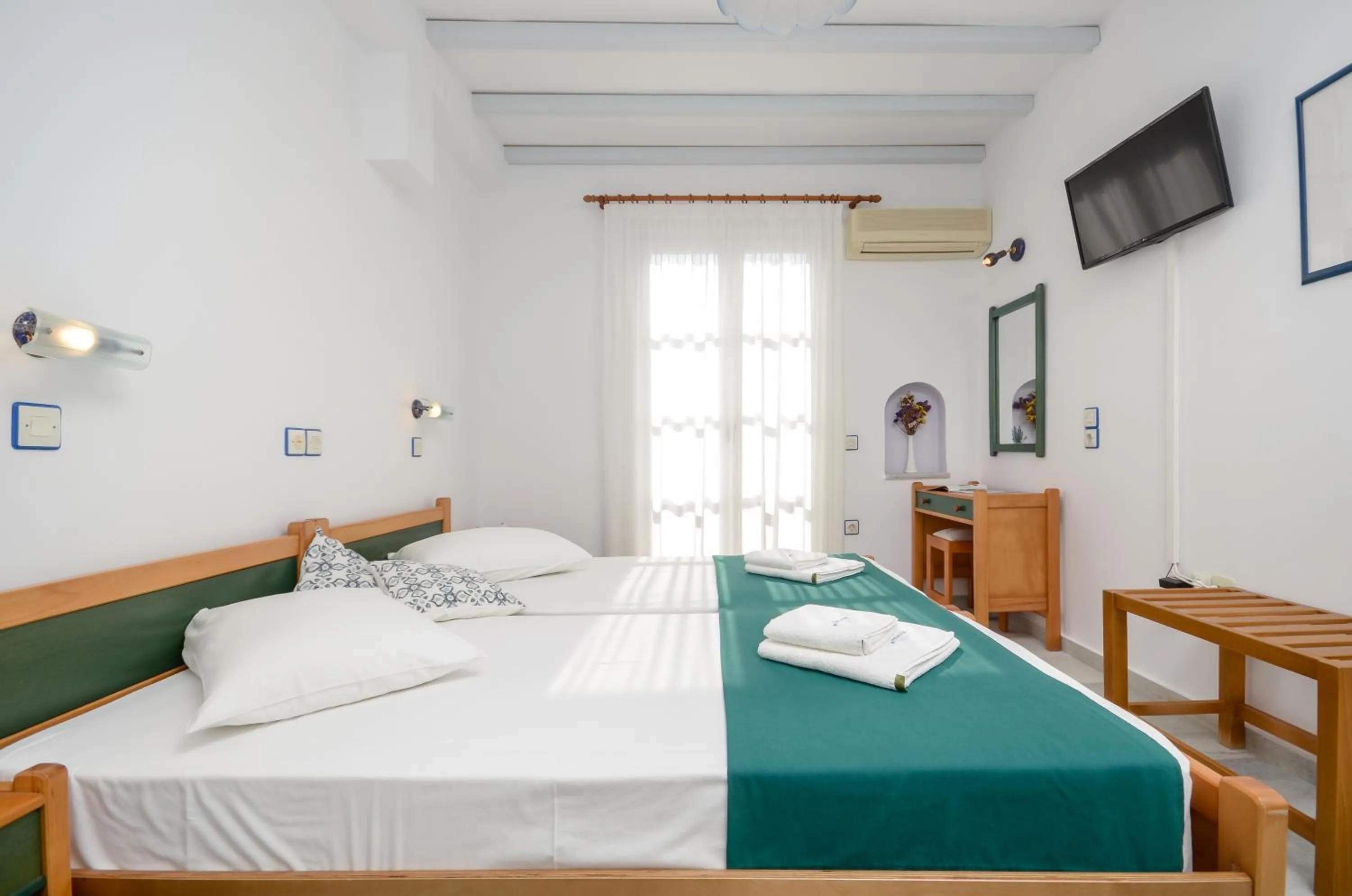 Spring, Bed in Nostos Studios at Saint George beach Agios Georgios Chora Naxos town