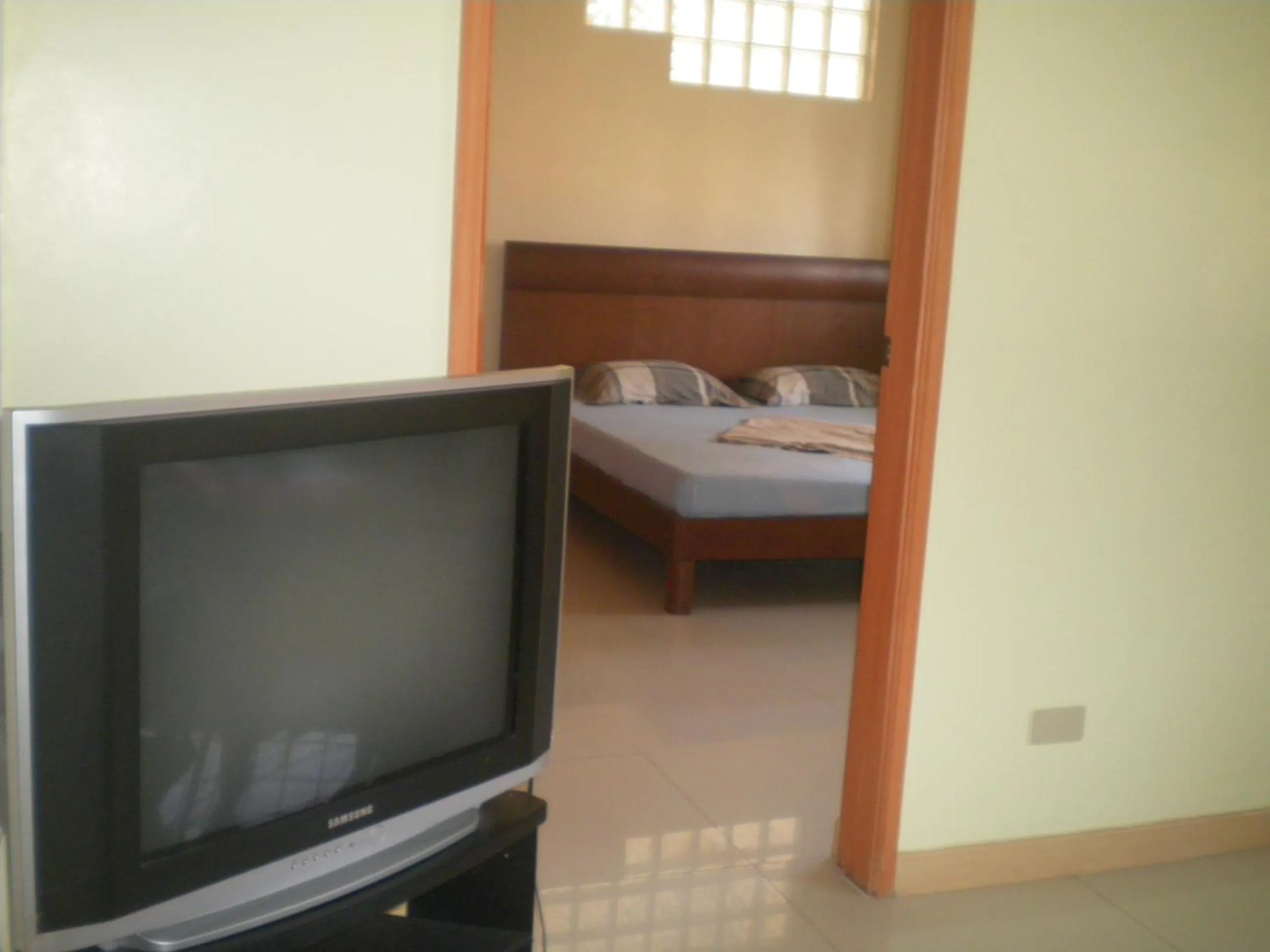 Bed in Dumaguete Springs Apartment