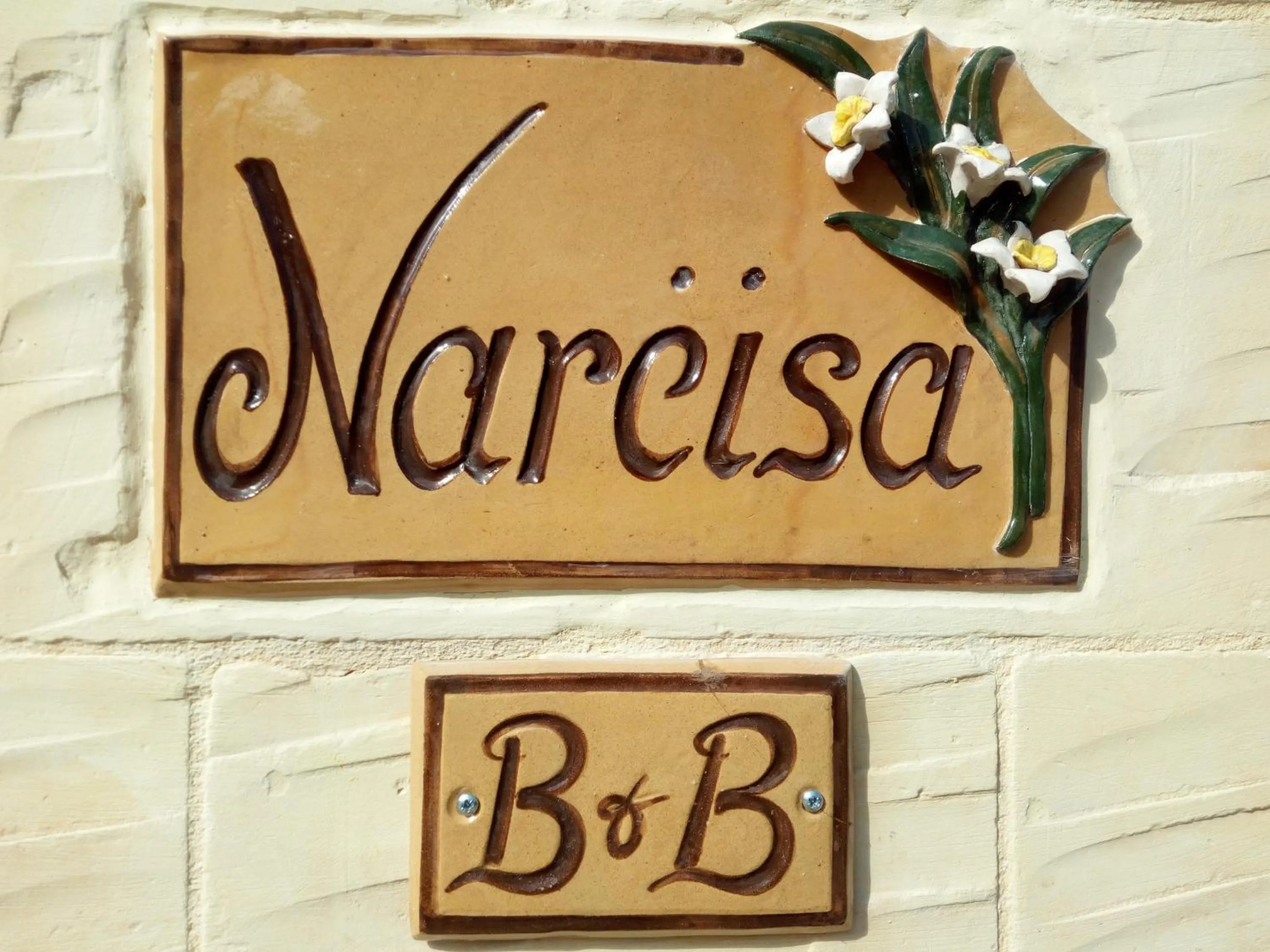 Property logo or sign in Narcisa Farmhouse