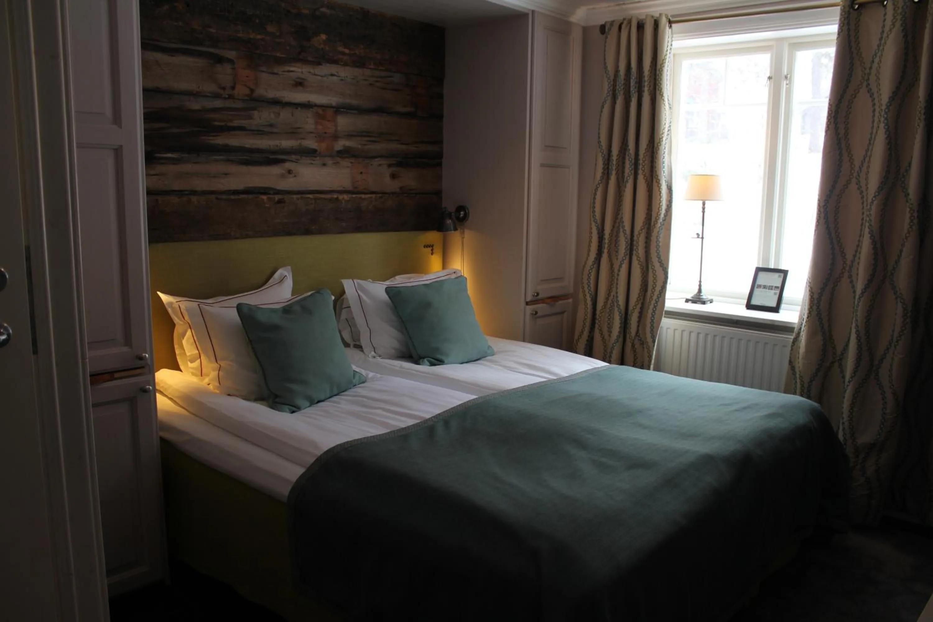 Bed in Olarsgården Hotell