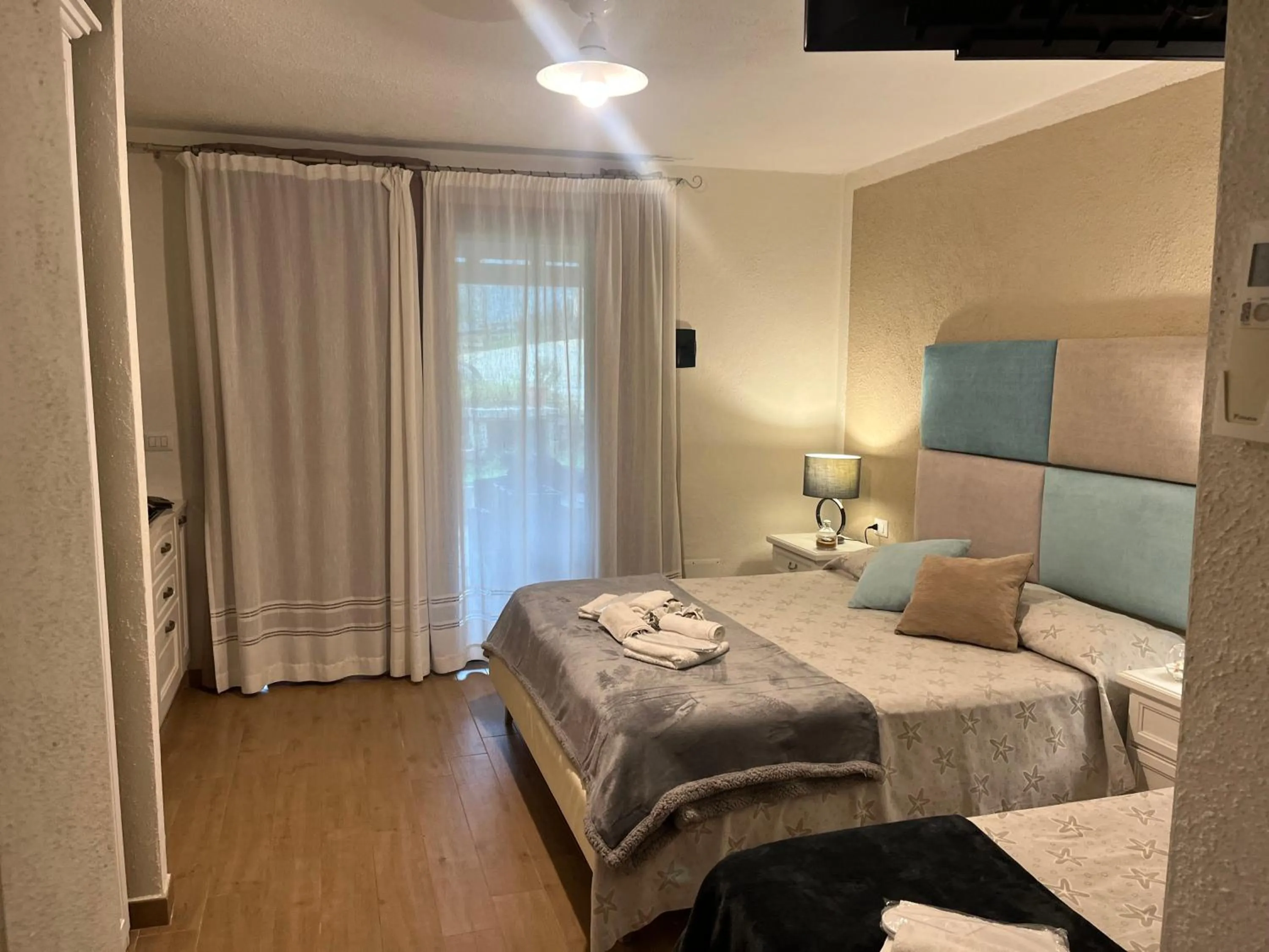 Bed in Il Giardino di Daniela Apartments