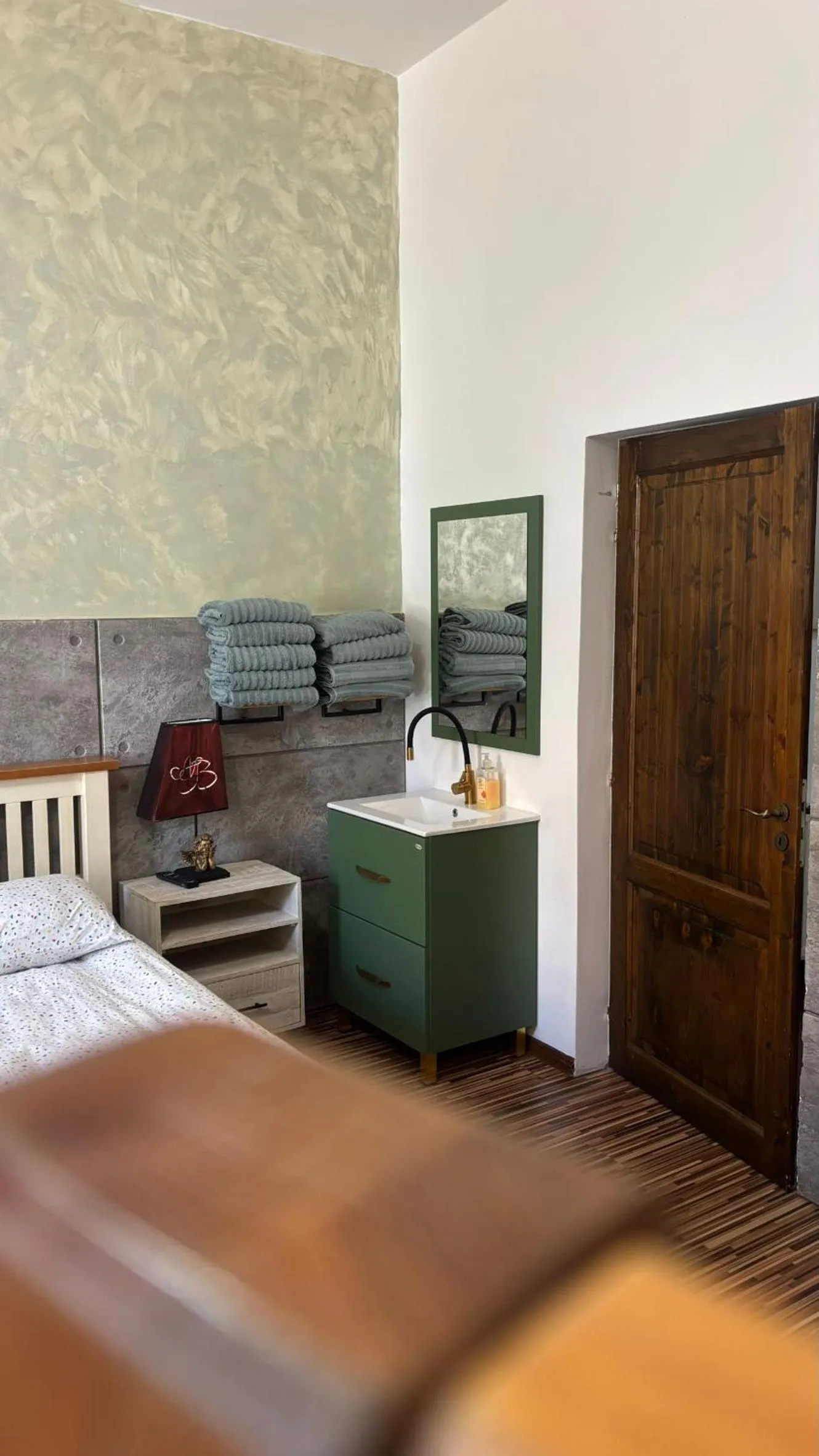 Bed in Pannónia Rooms and Apartments