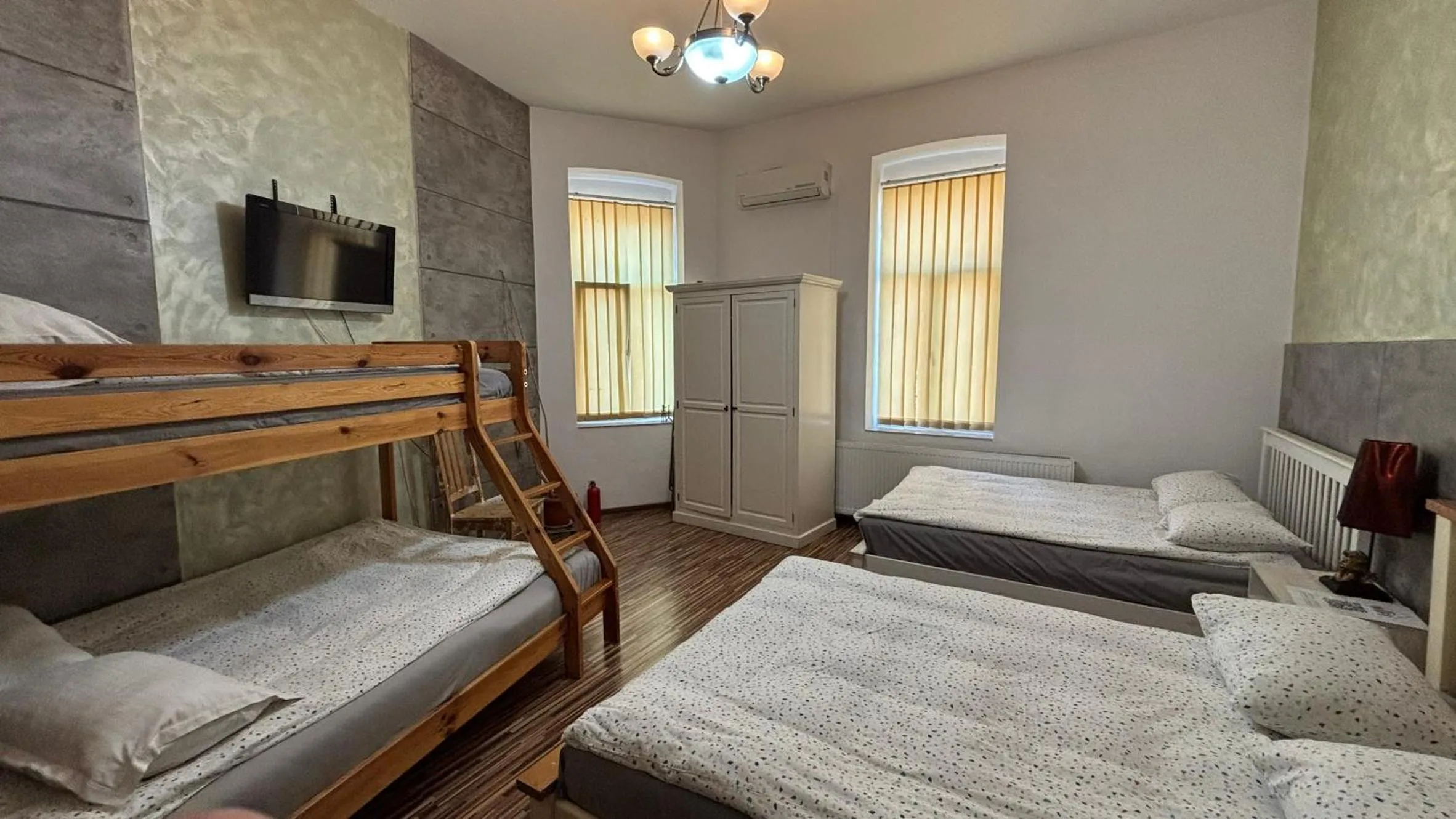 Bed in Pannónia Rooms and Apartments