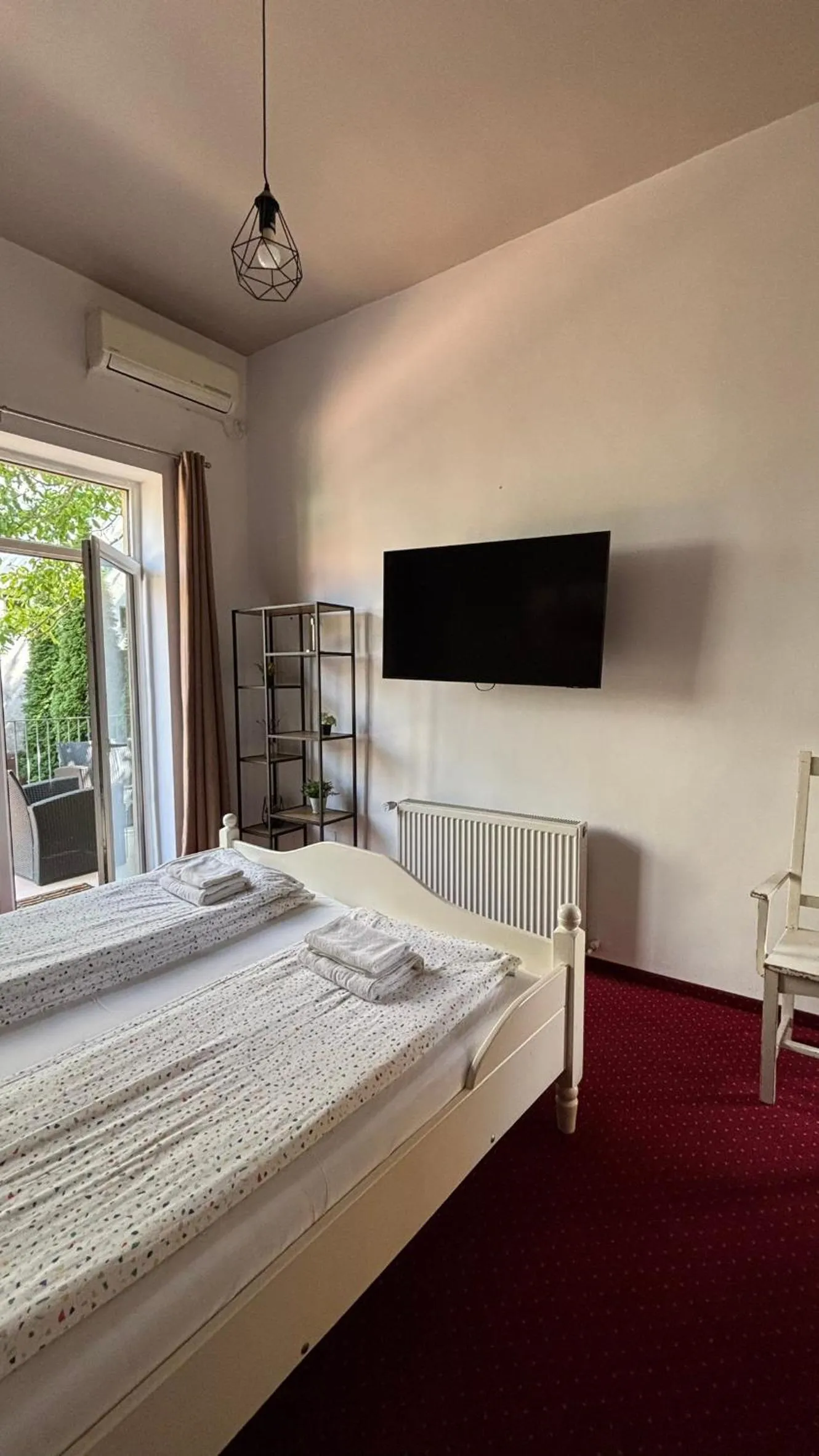 Bed in Pannónia Rooms and Apartments