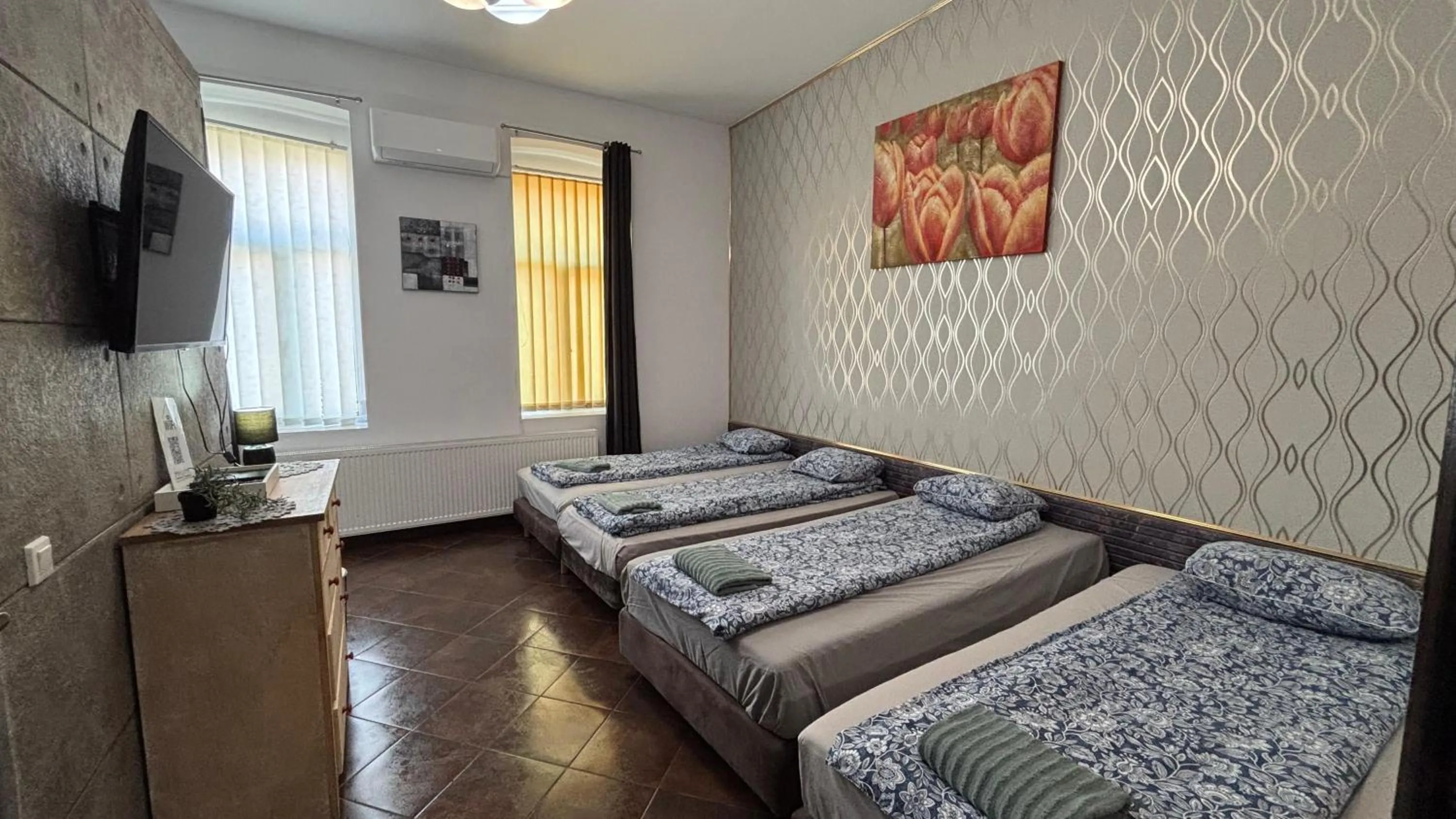 Bed in Pannónia Rooms and Apartments