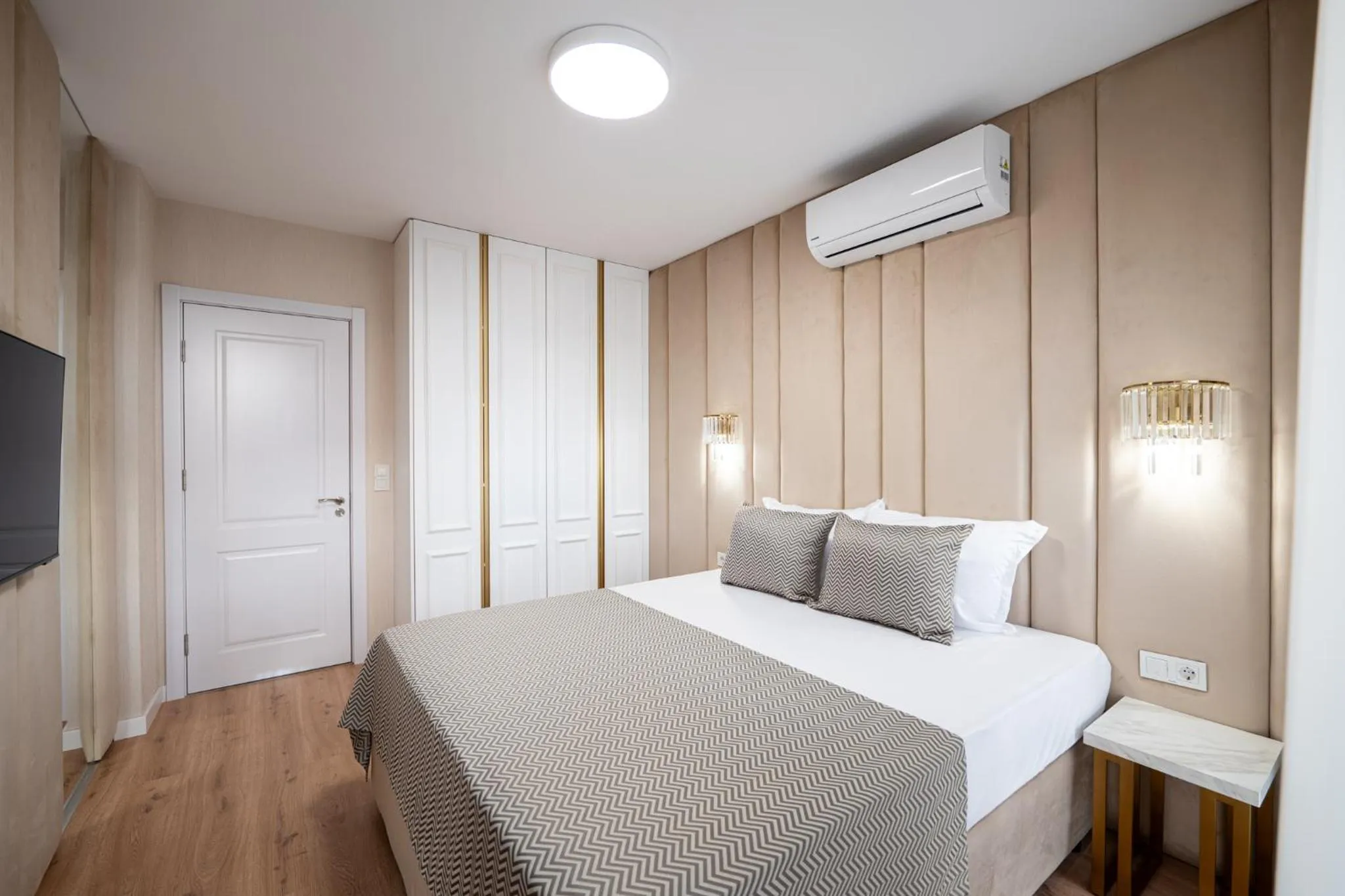 Bed in Harmony Suites Grand Resort