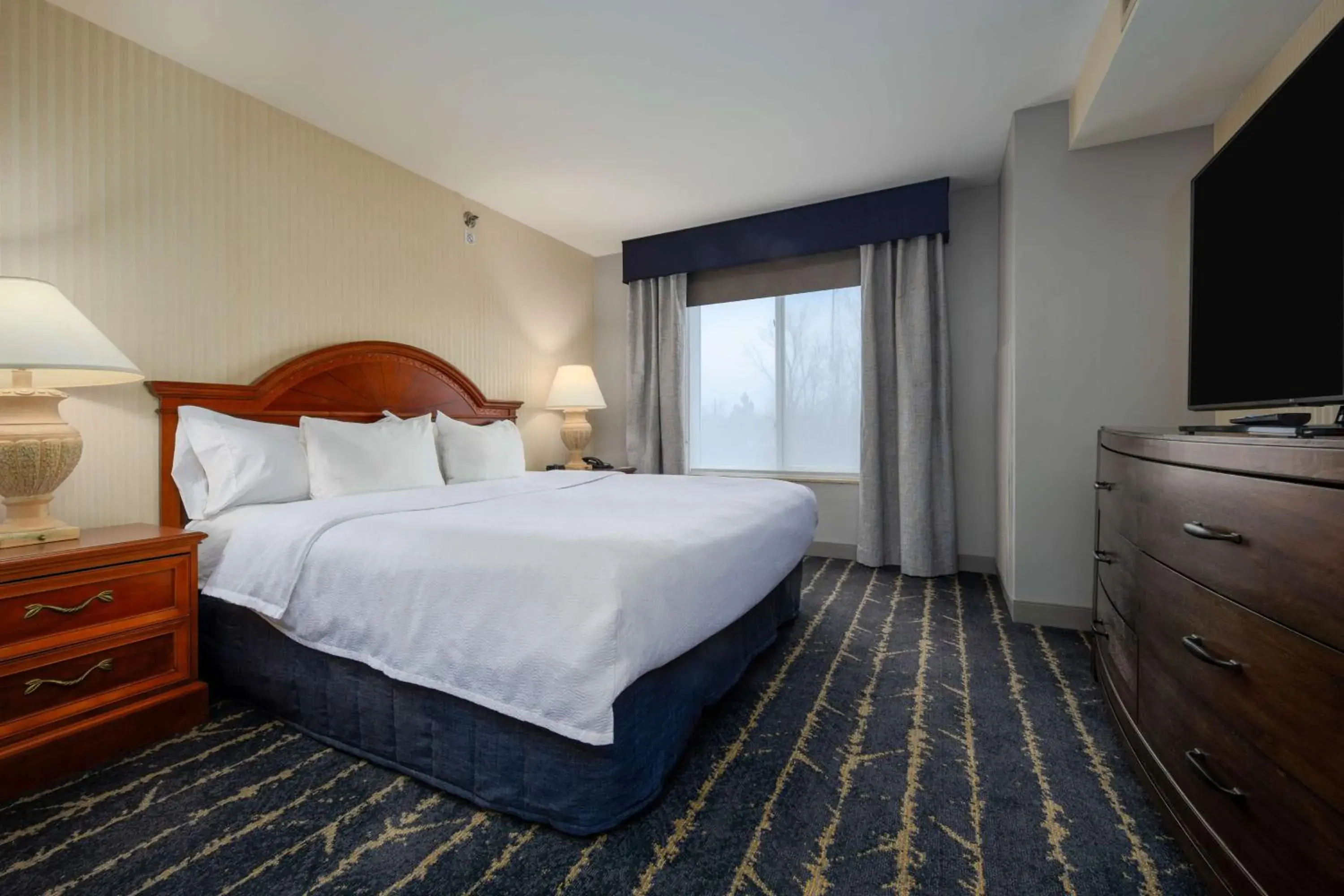 Junior Suite with One King Bed and Double Sofa Bed in Hilton Garden Inn Milwaukee Northwest Conference Center Junior Suite with One King Bed and Double Sofa Bed in Hilton Garden Inn Milwaukee Northwest Conference Center