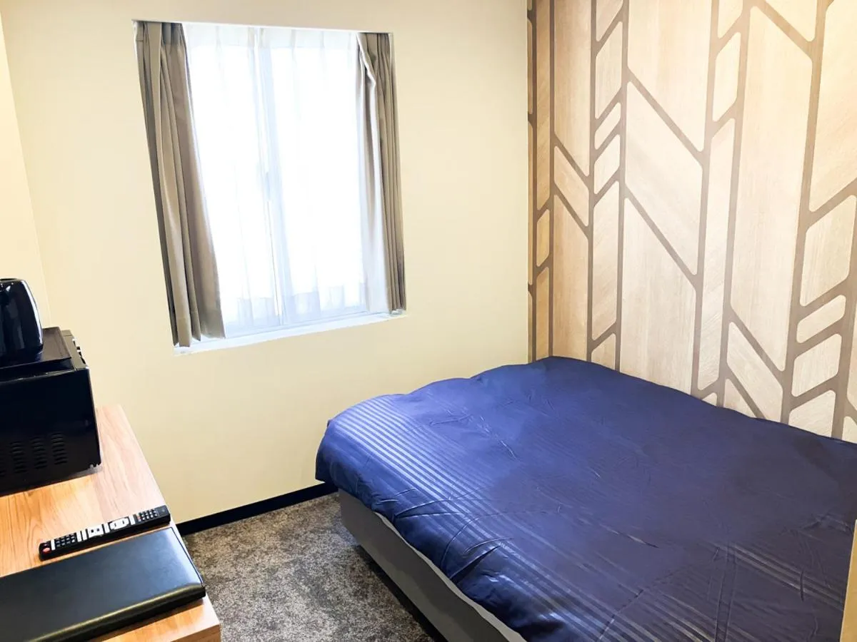 Bed in HOTEL LiVEMAX BUDGET Iyo Mishima