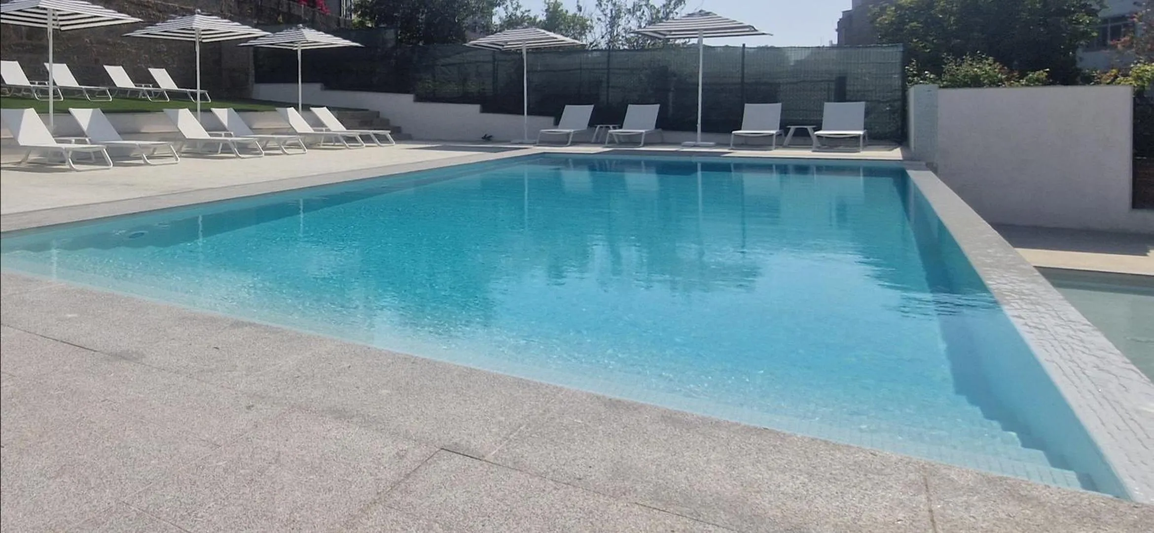 Swimming pool in La Suite Hotel