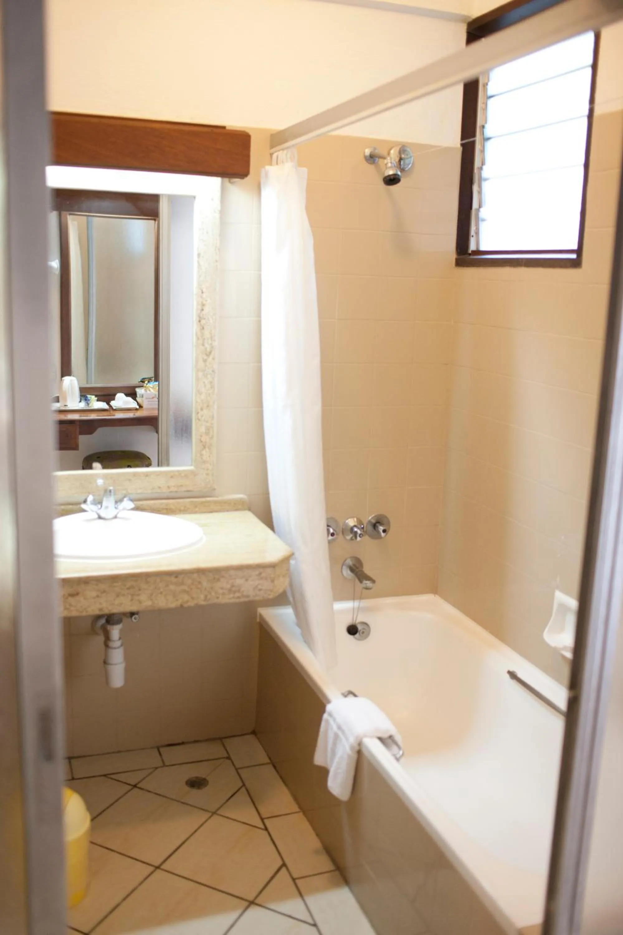 Bathroom in Travellers Beach Hotel & SPA