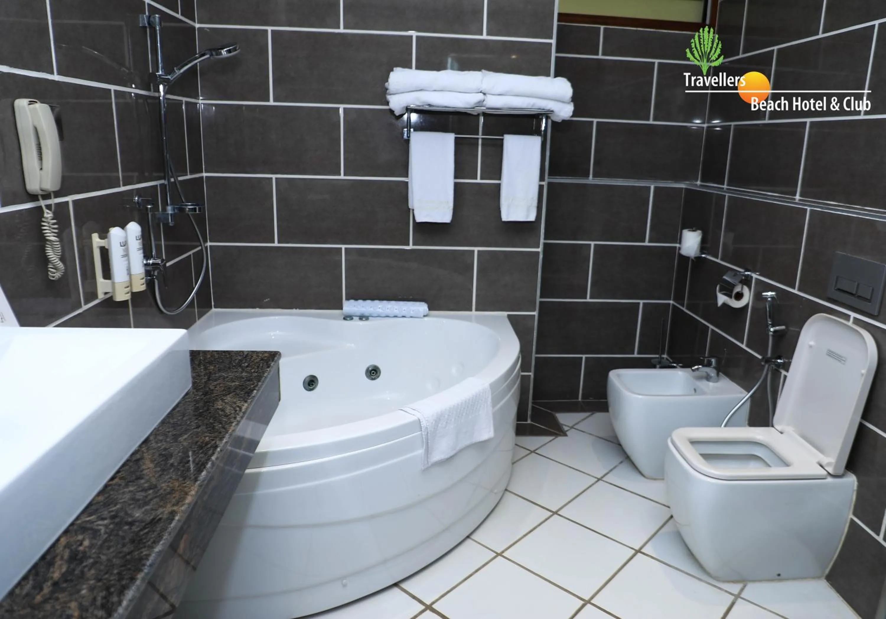 Bathroom in Travellers Beach Hotel & SPA