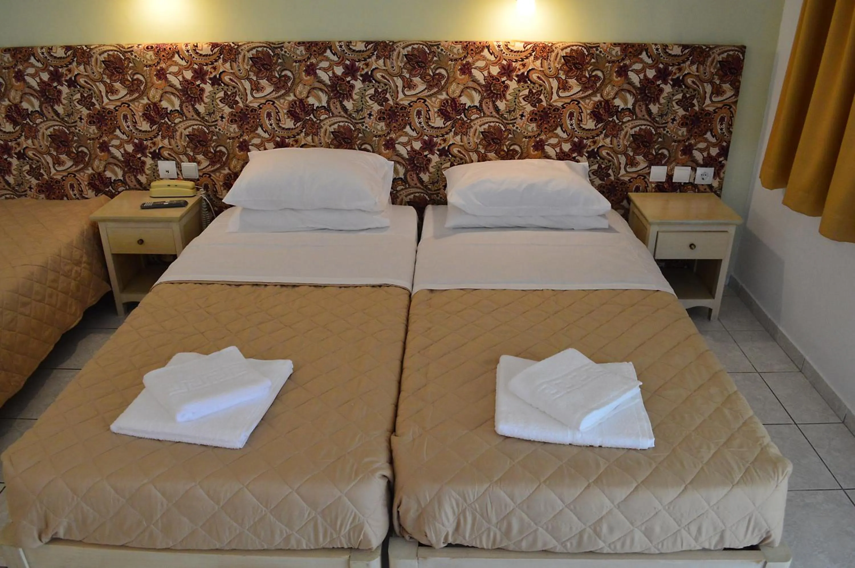 Bed in Alexandros Hotel