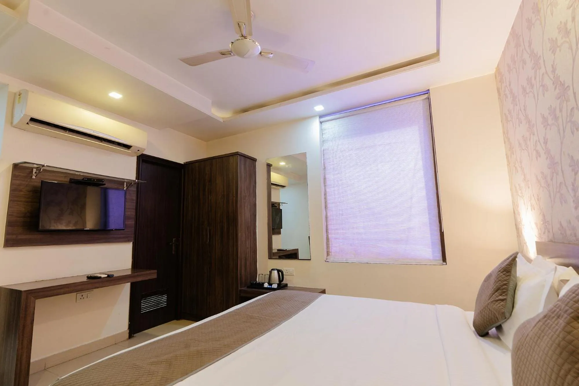 Bed in FabHotel Signature Inn