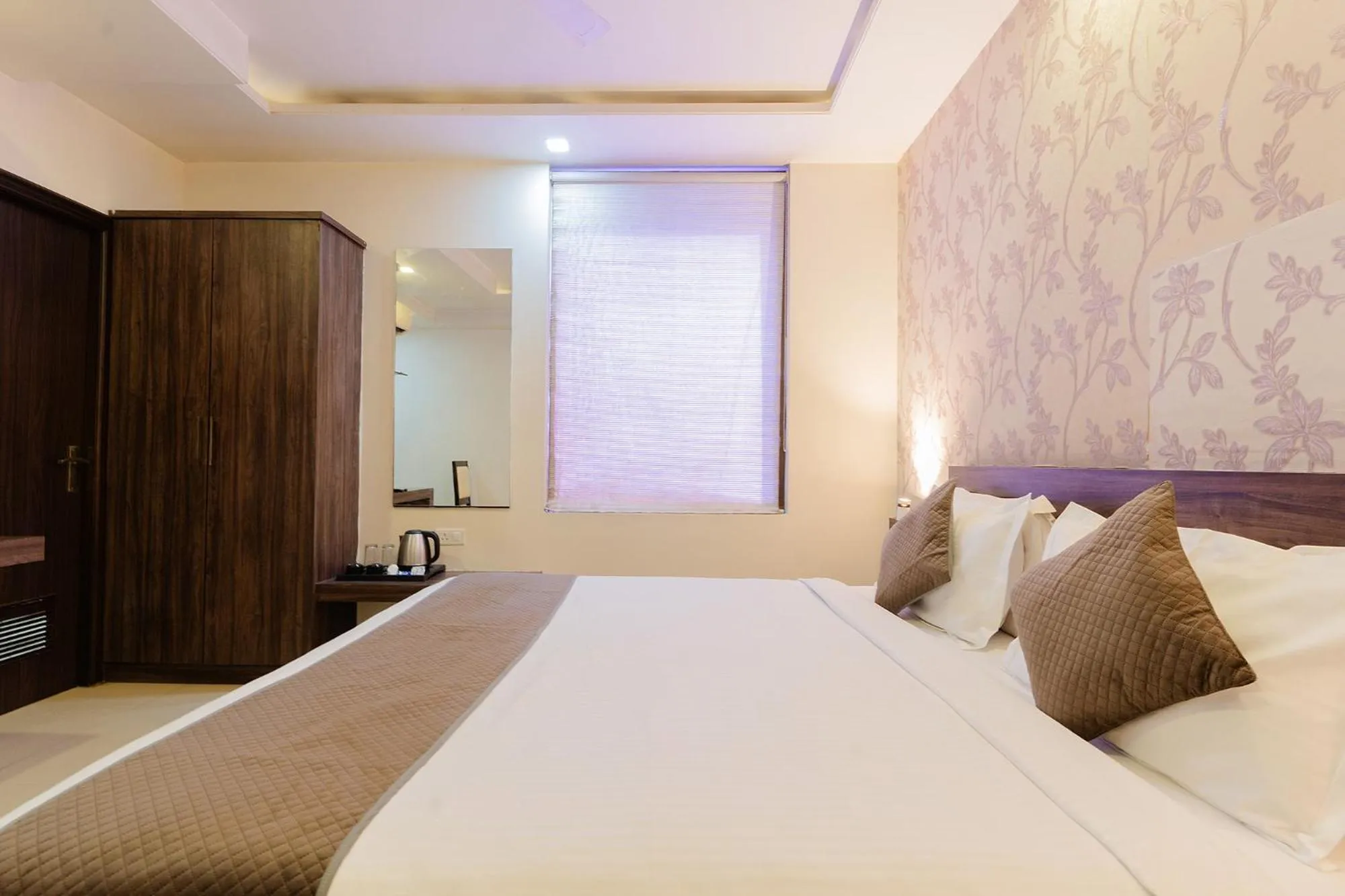 Bed in FabHotel Signature Inn