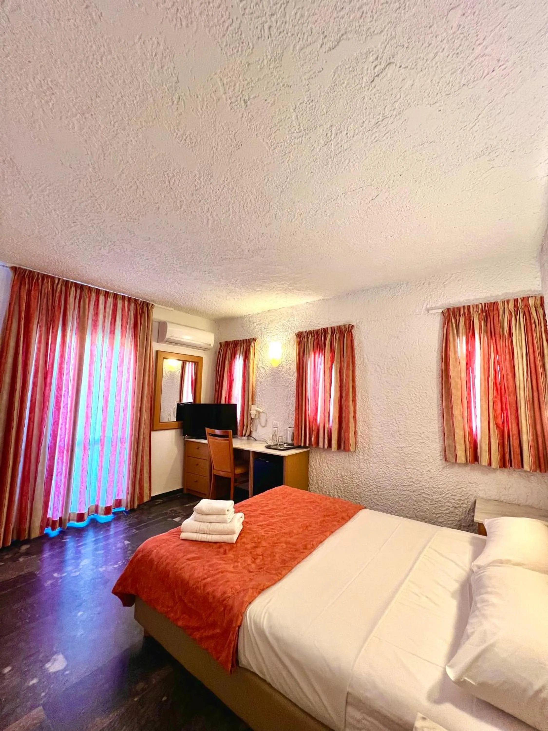 Bed in Karteros Hotel