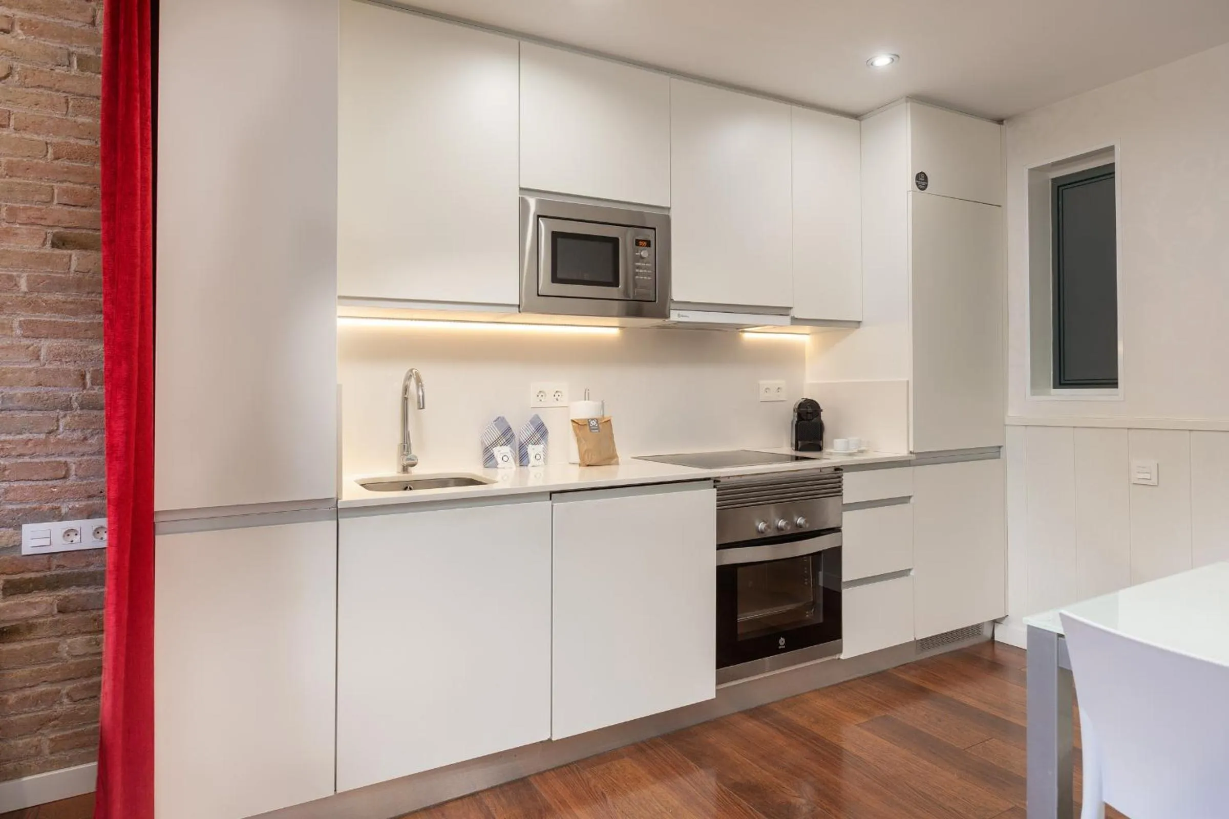Kitchen or kitchenette in Enjoybcn Gaudi Apartments