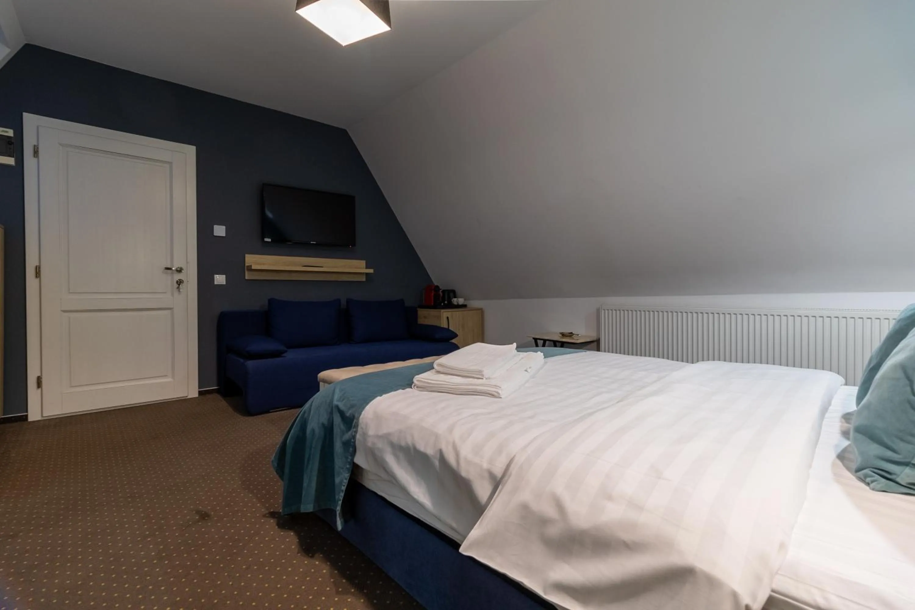 Photo of the whole room, Bed in Lumiere House Sibiu