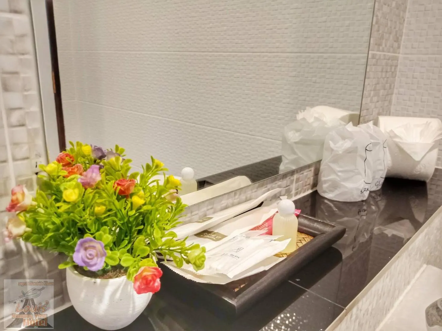 Bathroom in Louis' Runway View Hotel - SHA Extra Plus