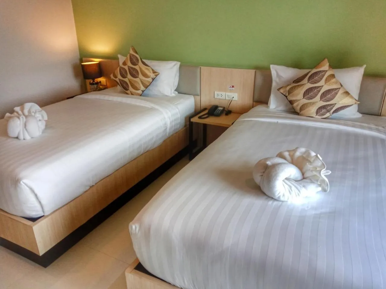 Bed in Louis' Runway View Hotel - SHA Extra Plus