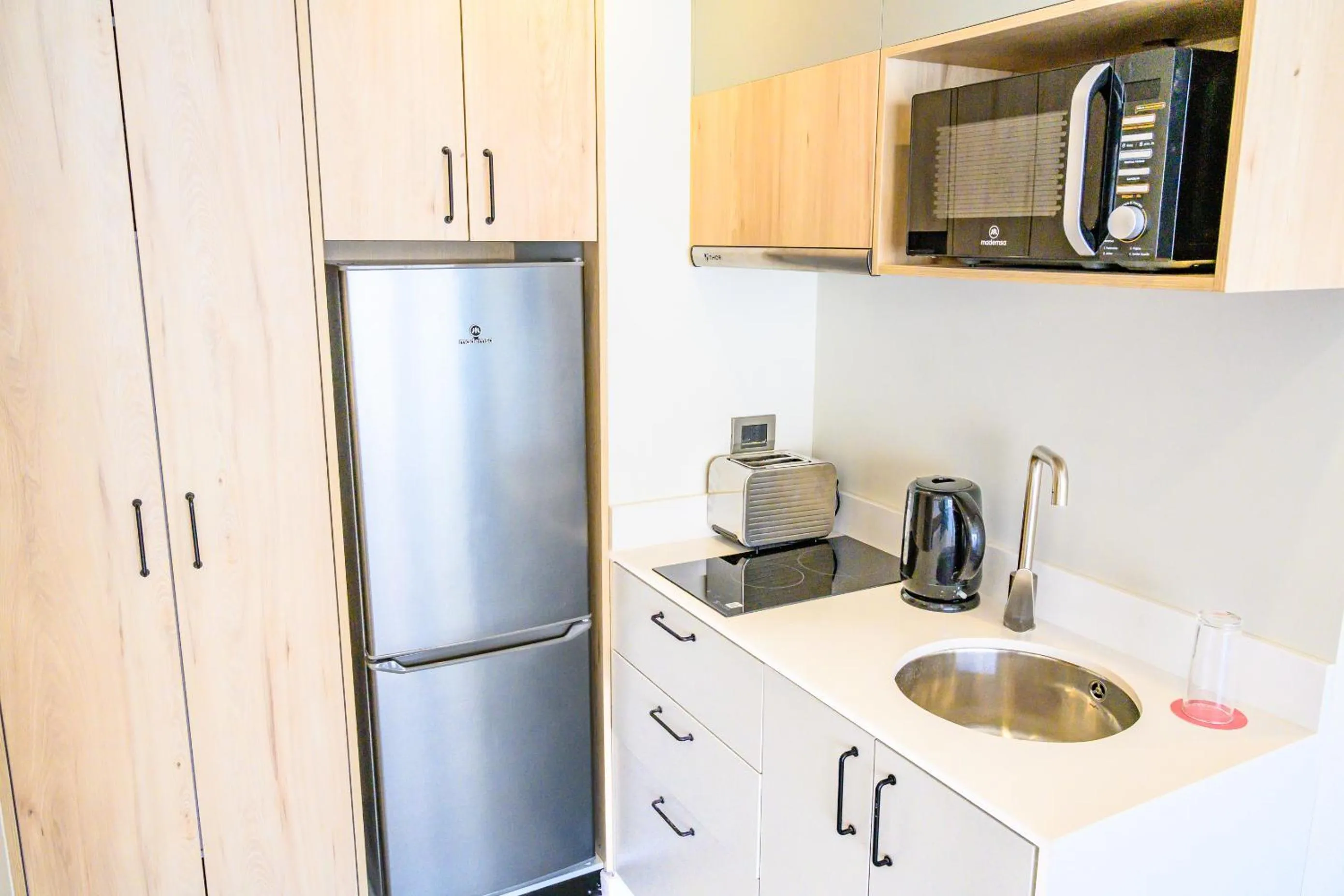 Kitchen or kitchenette in Studio 56 Apart Hotel by Terrado Iquique