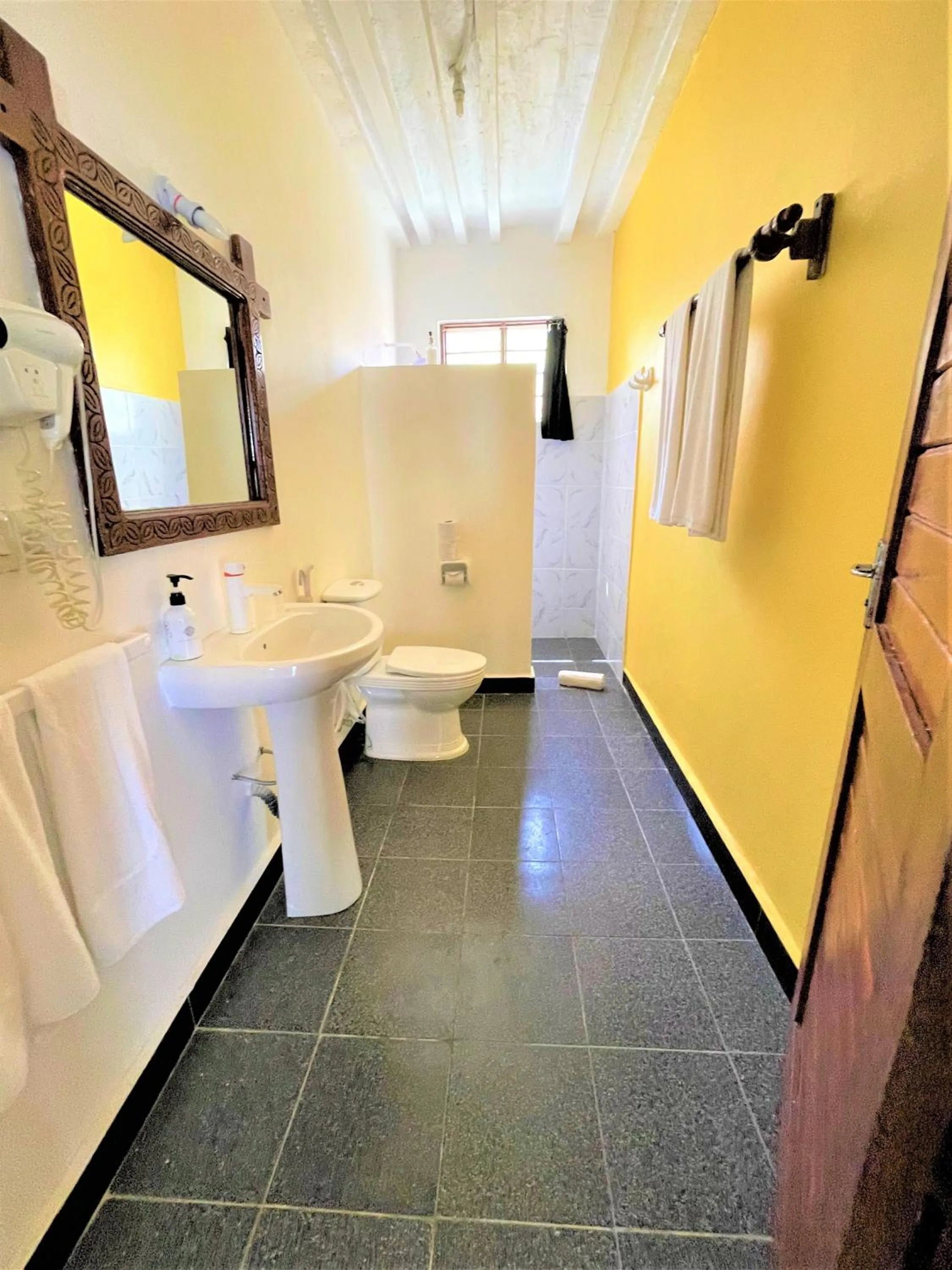 Bathroom in Paradise Beach Resort & Spa