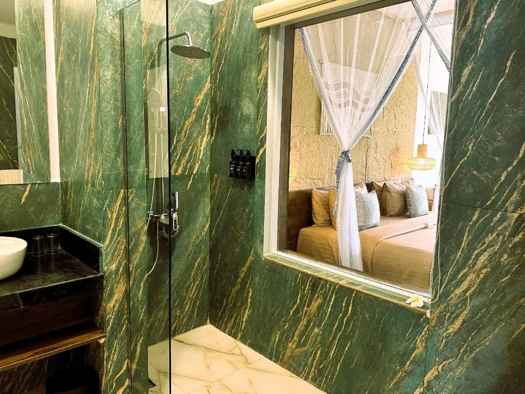 Bathroom in Paradise Beach Resort & Spa