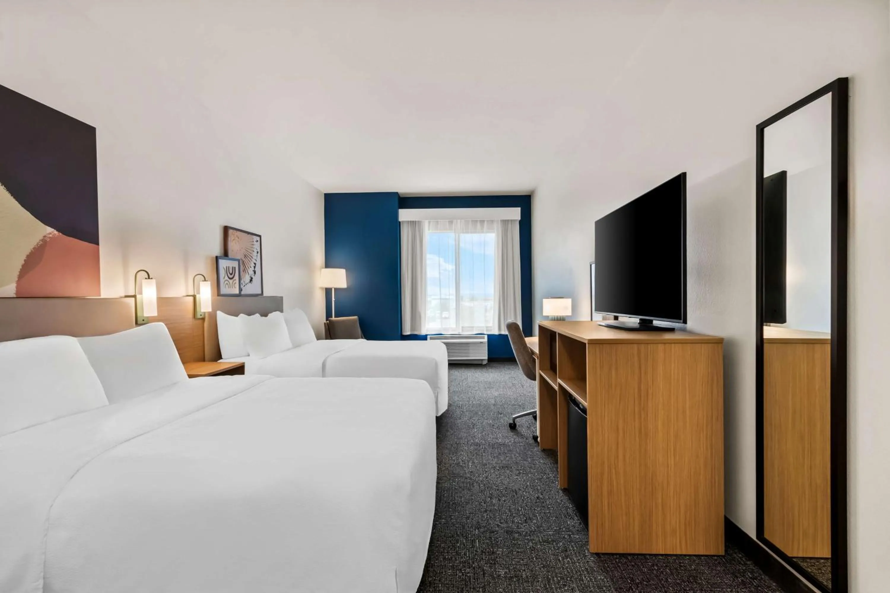 Bed in Legacy Inn & Suites