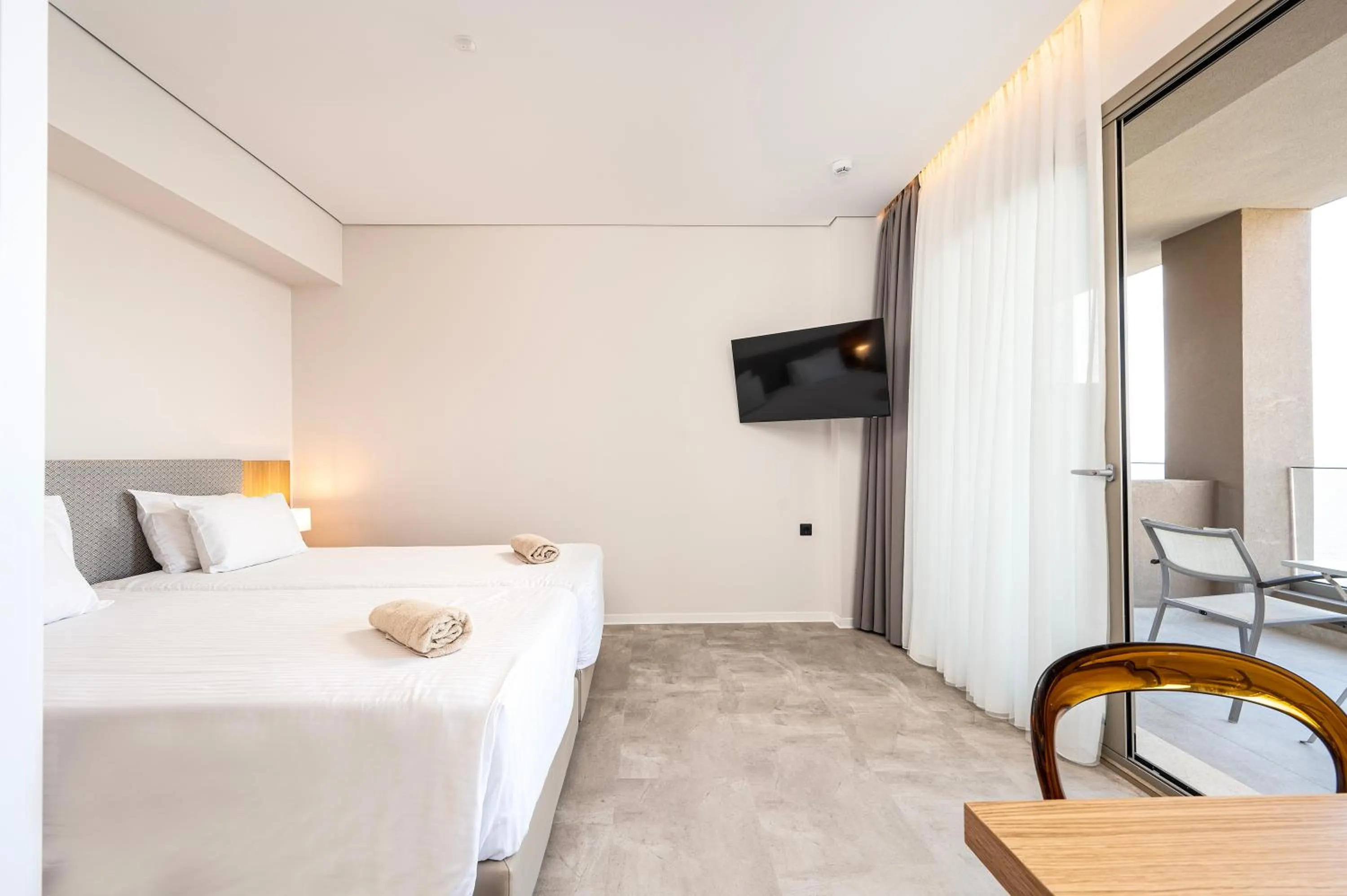 Bed in Athina Palace Resort & Spa