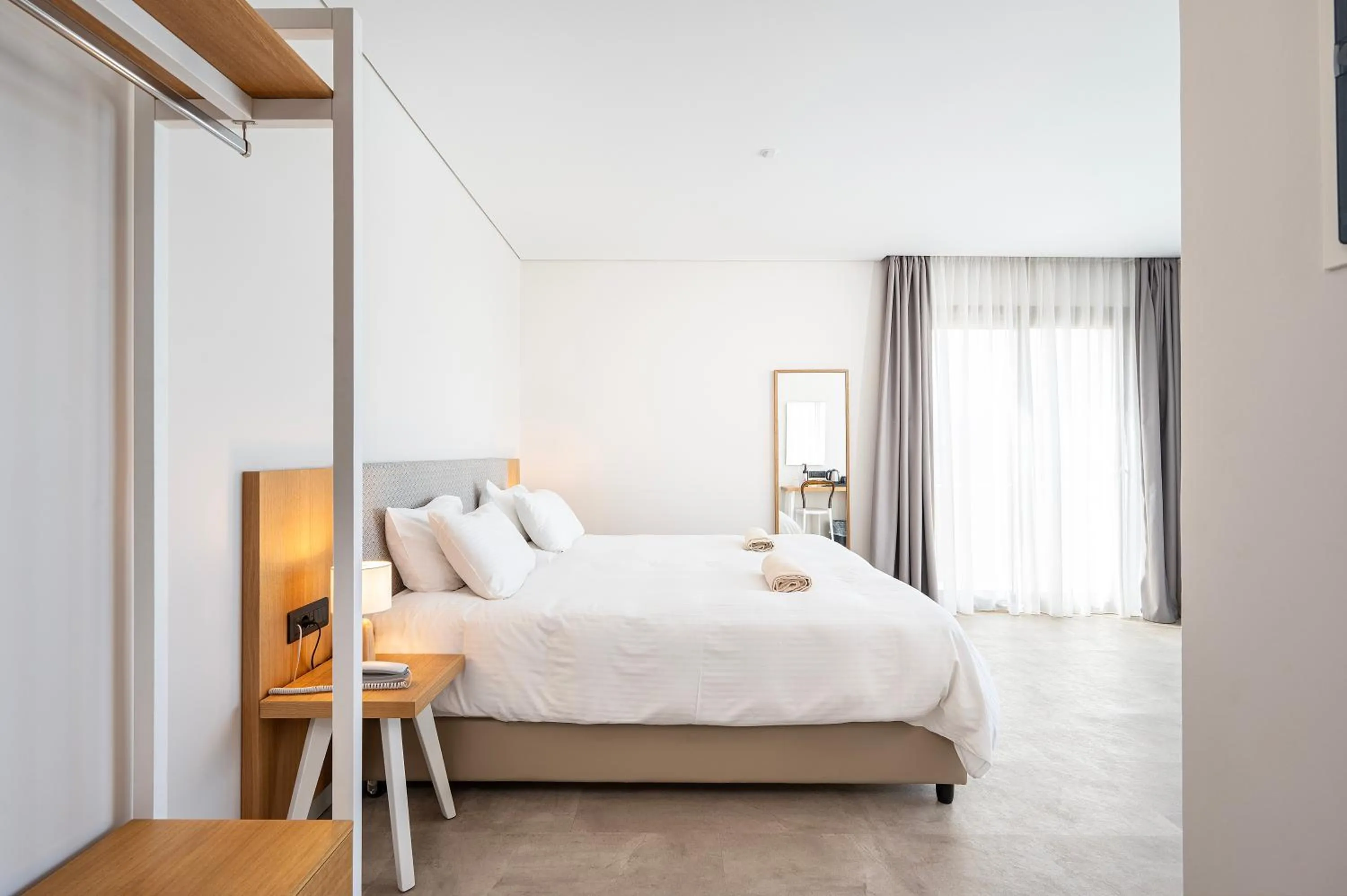 Bed in Athina Palace Resort & Spa