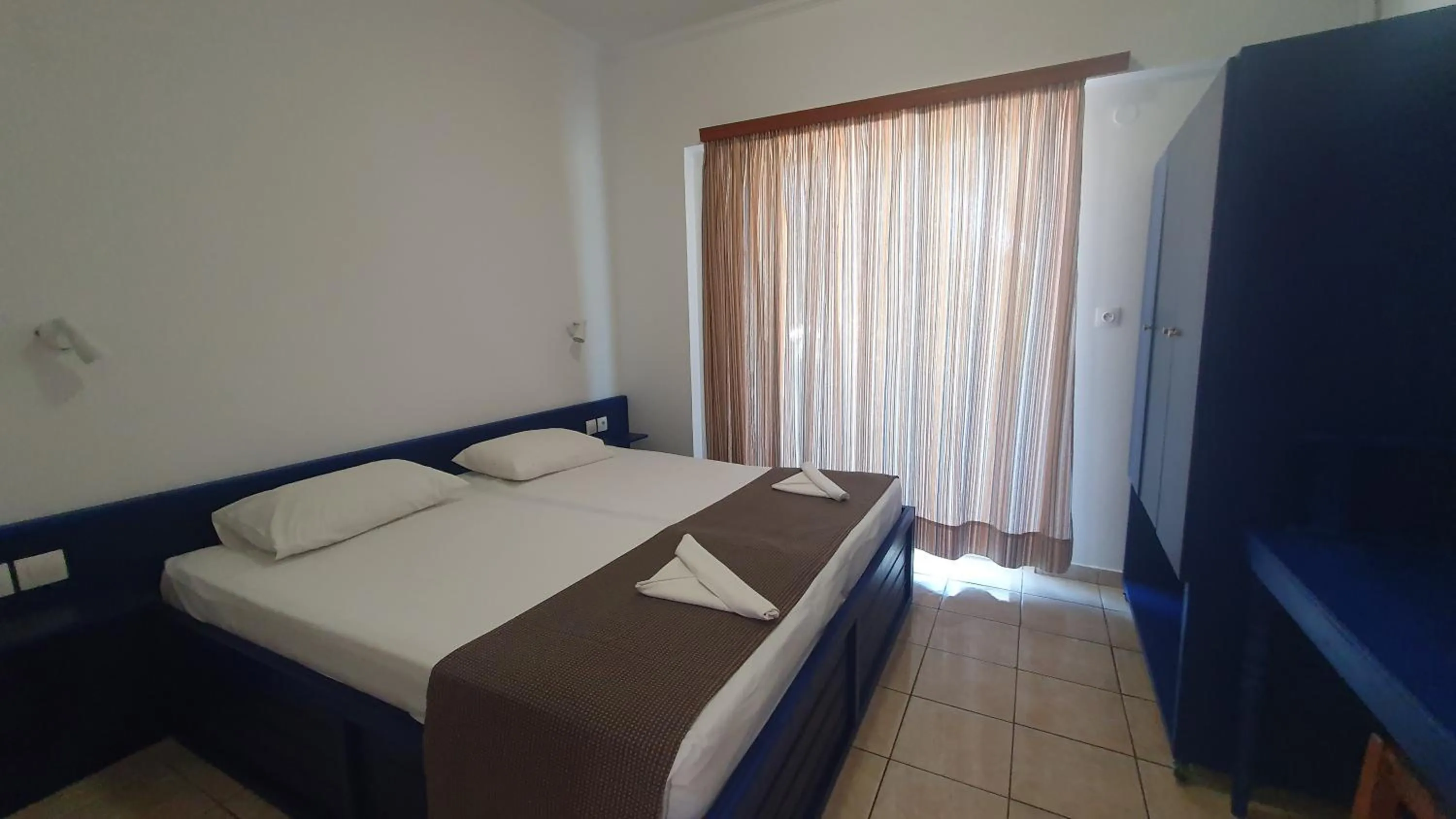 Bed in Filoxenia Apartments & Studios