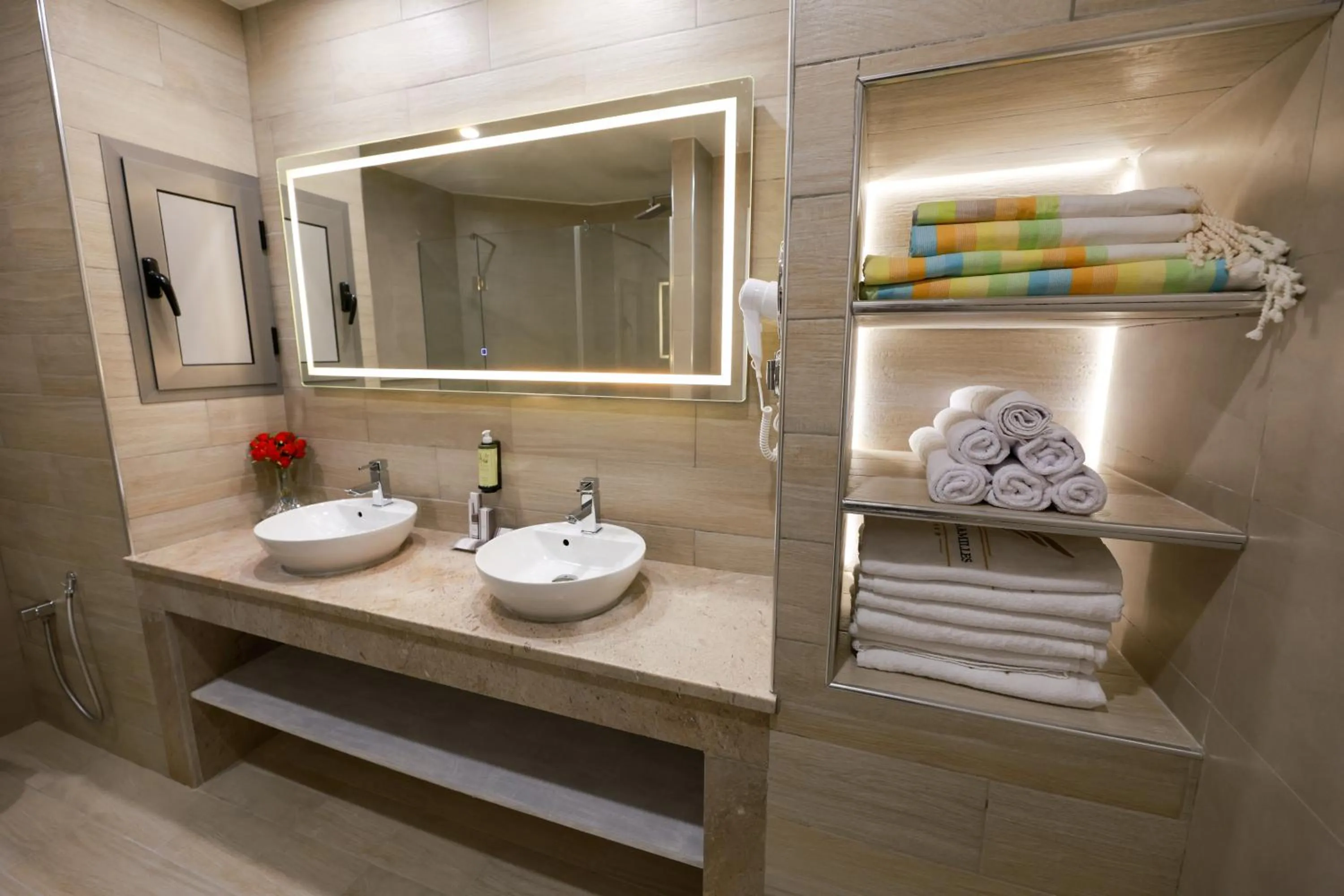 Bathroom in Suites Hôtel Les Charmilles & Spa