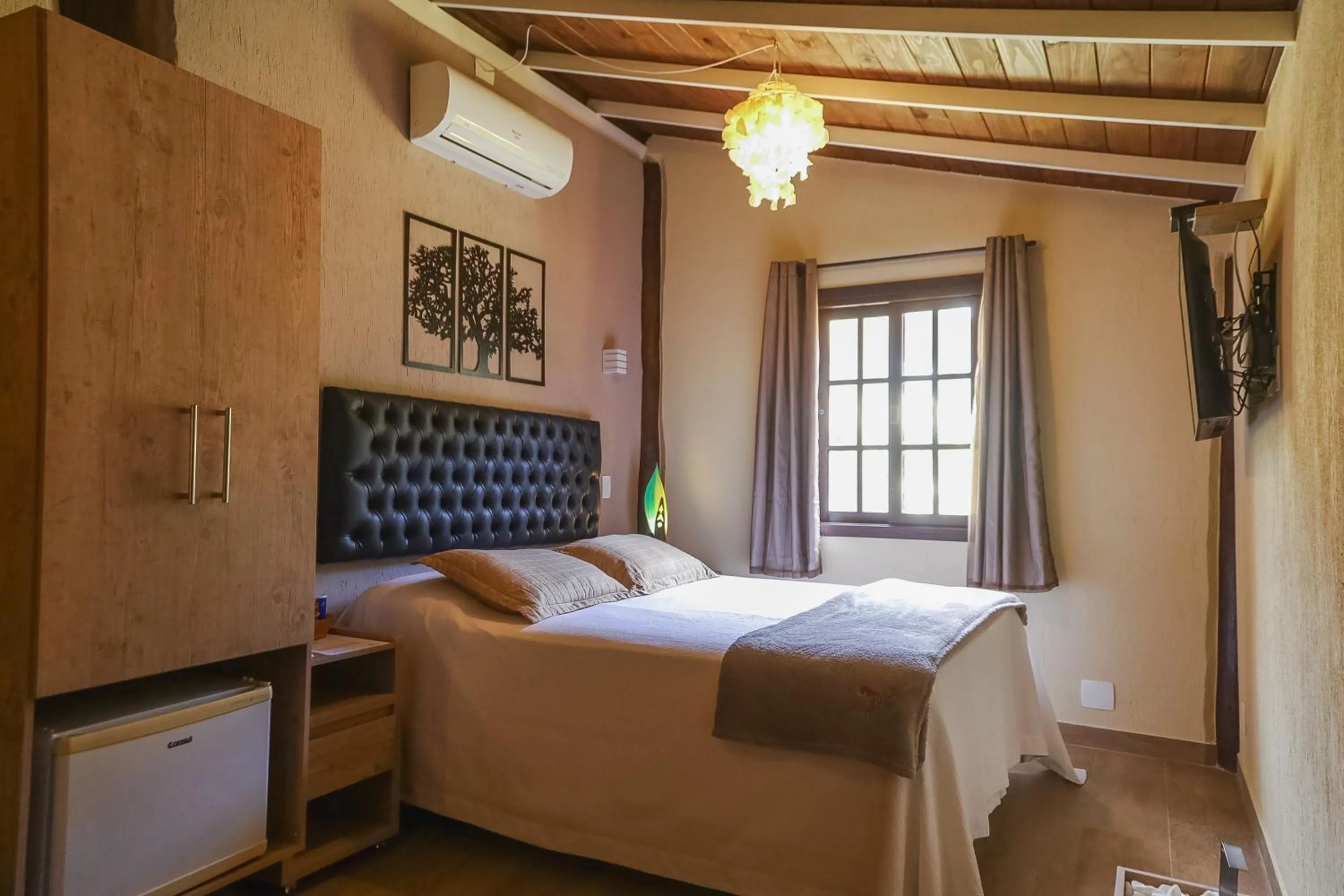 Bed in Pousada Cantagalo