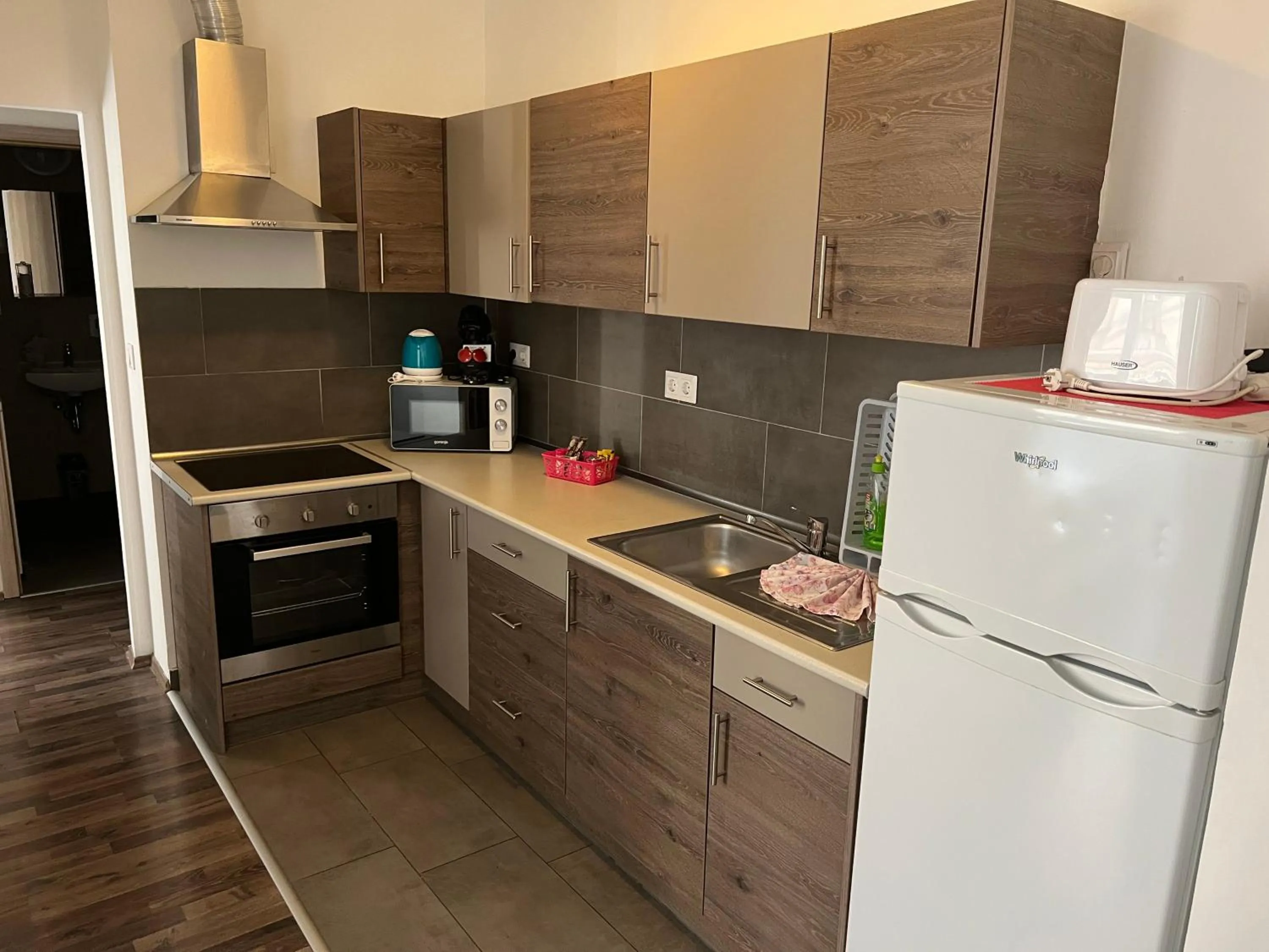 Kitchen or kitchenette in Nova City Apartments