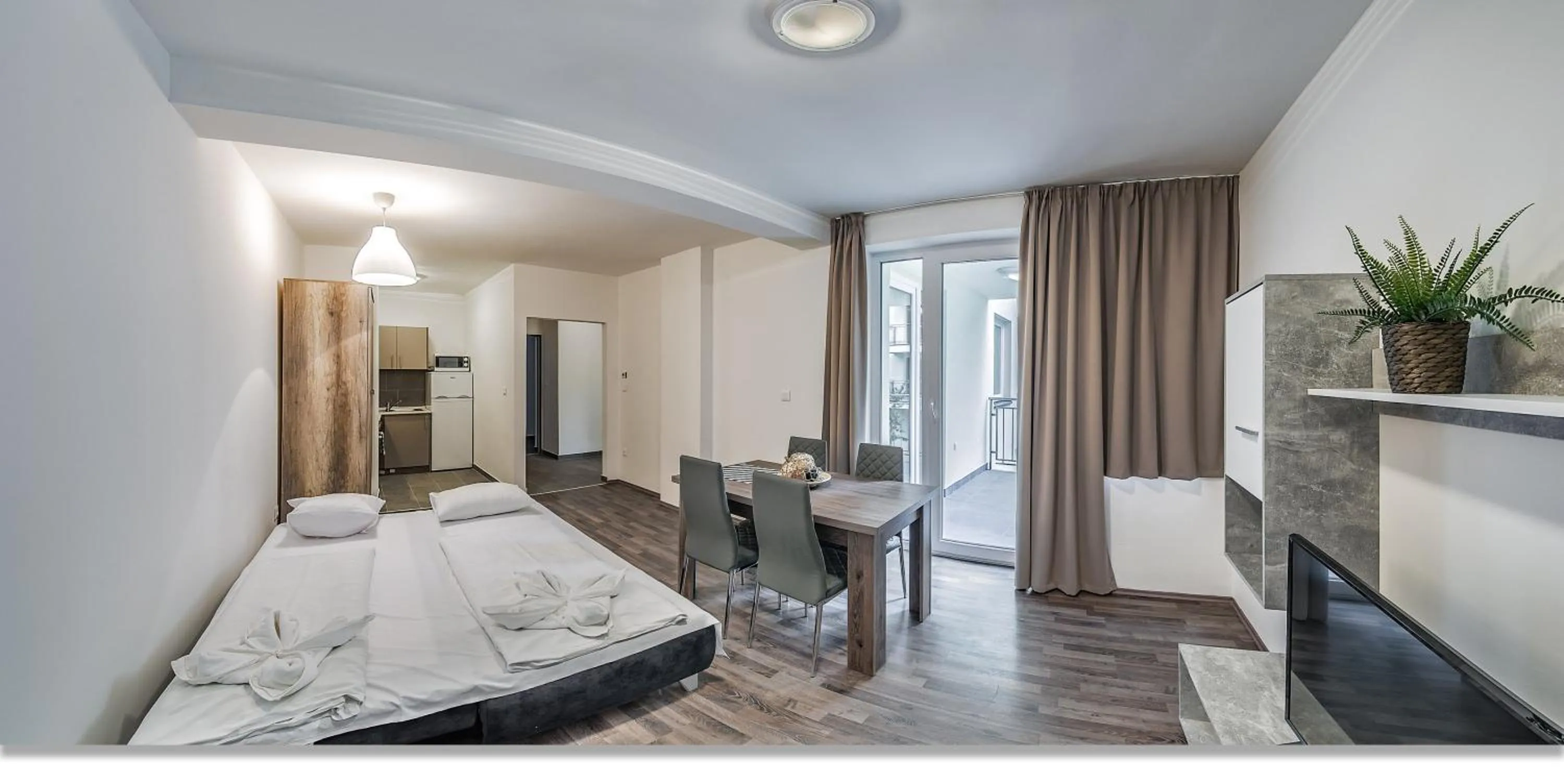 Photo of the whole room, Bed in Nova City Apartments