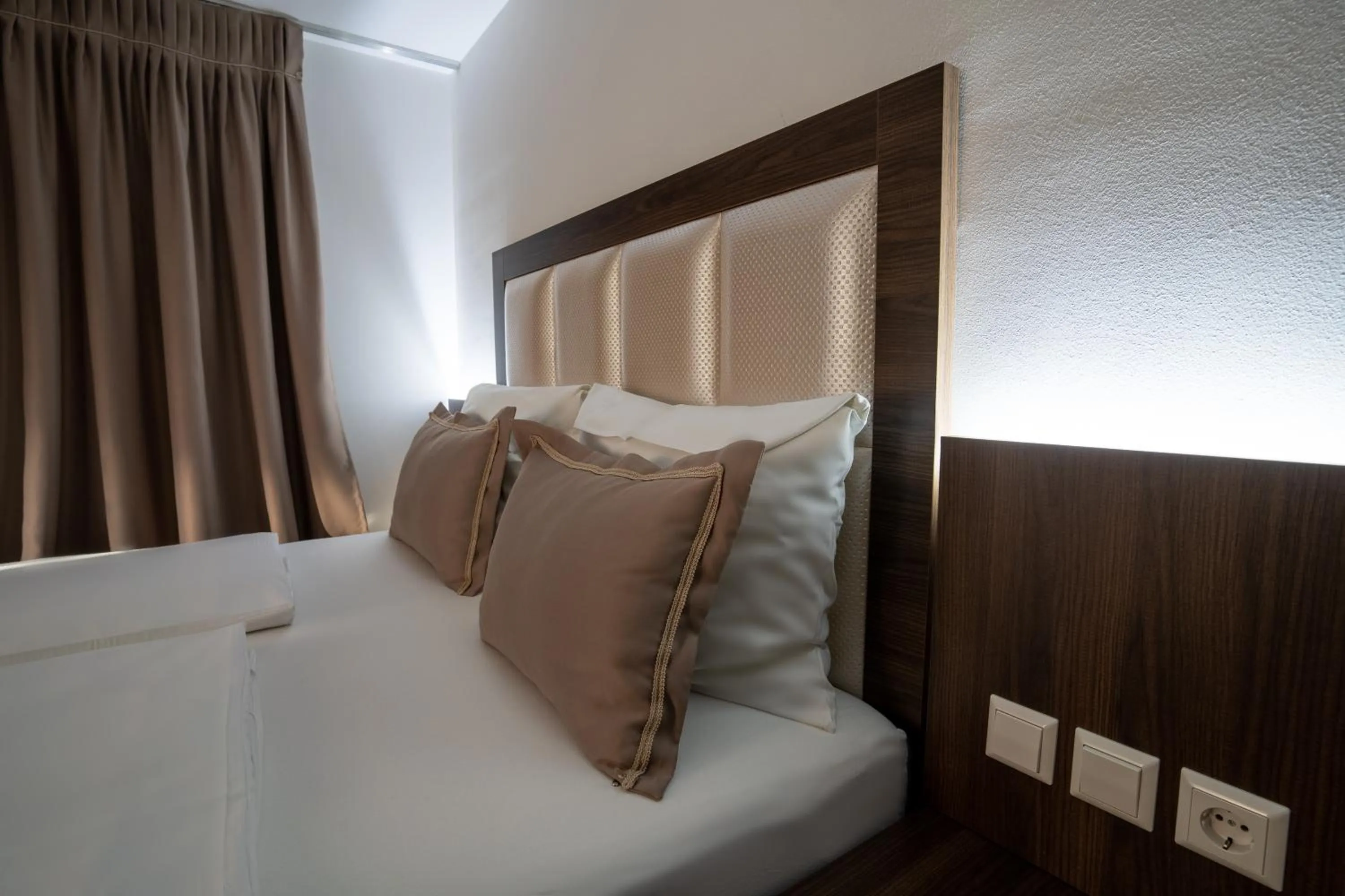 Bed in Hotel Myrsini