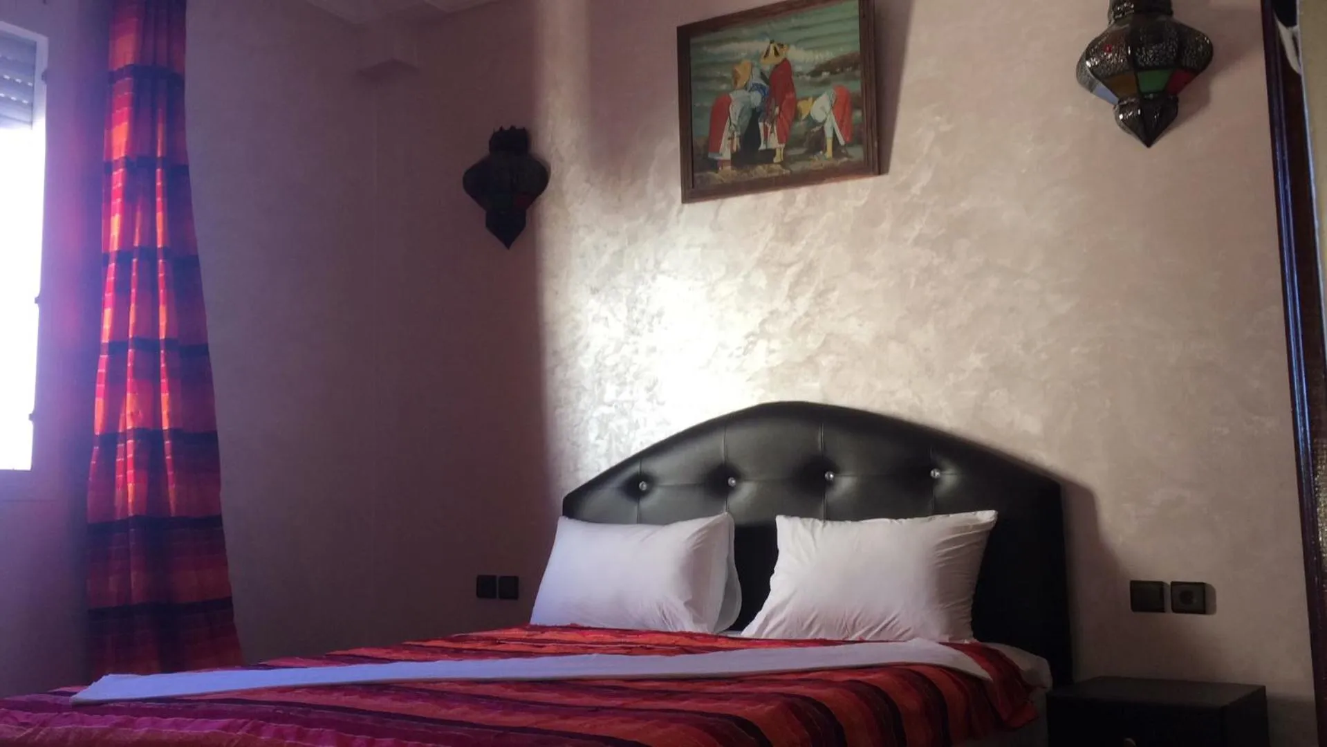 Bed in ITRANE GUEST HOUSE