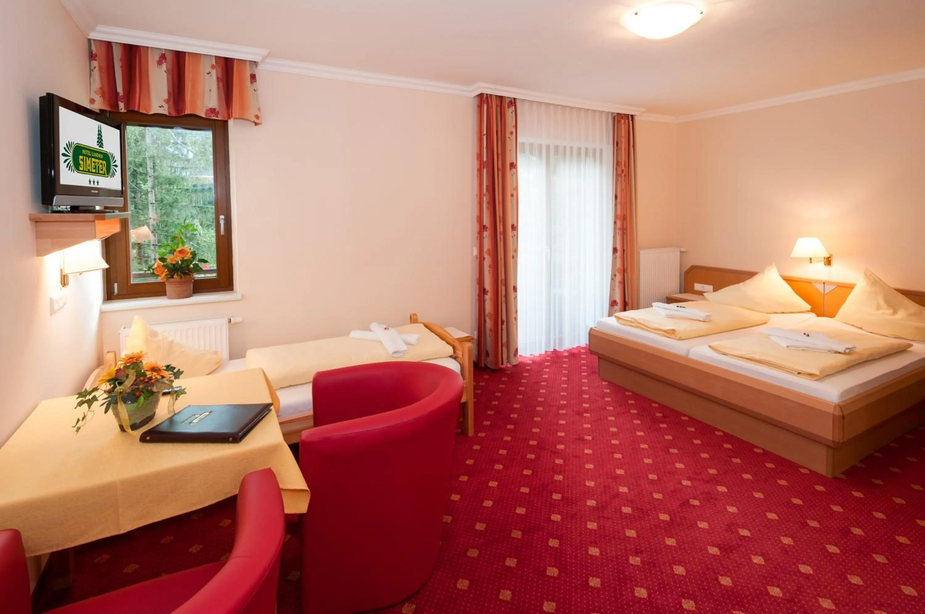 Photo of the whole room, Bed in Hotel Landhof Simeter GMBH