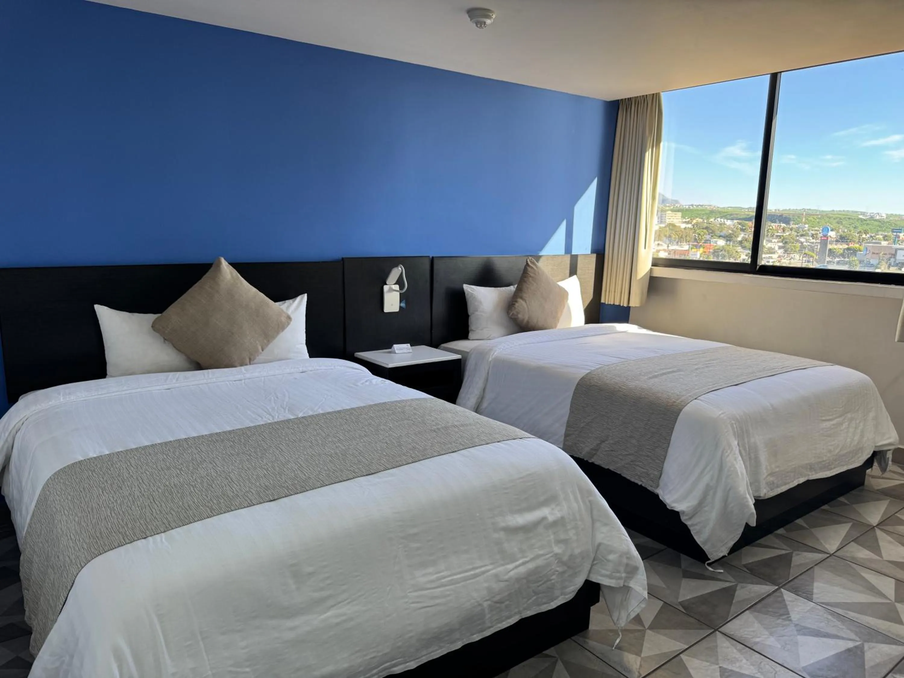 Bed in Hotel Corona Plaza