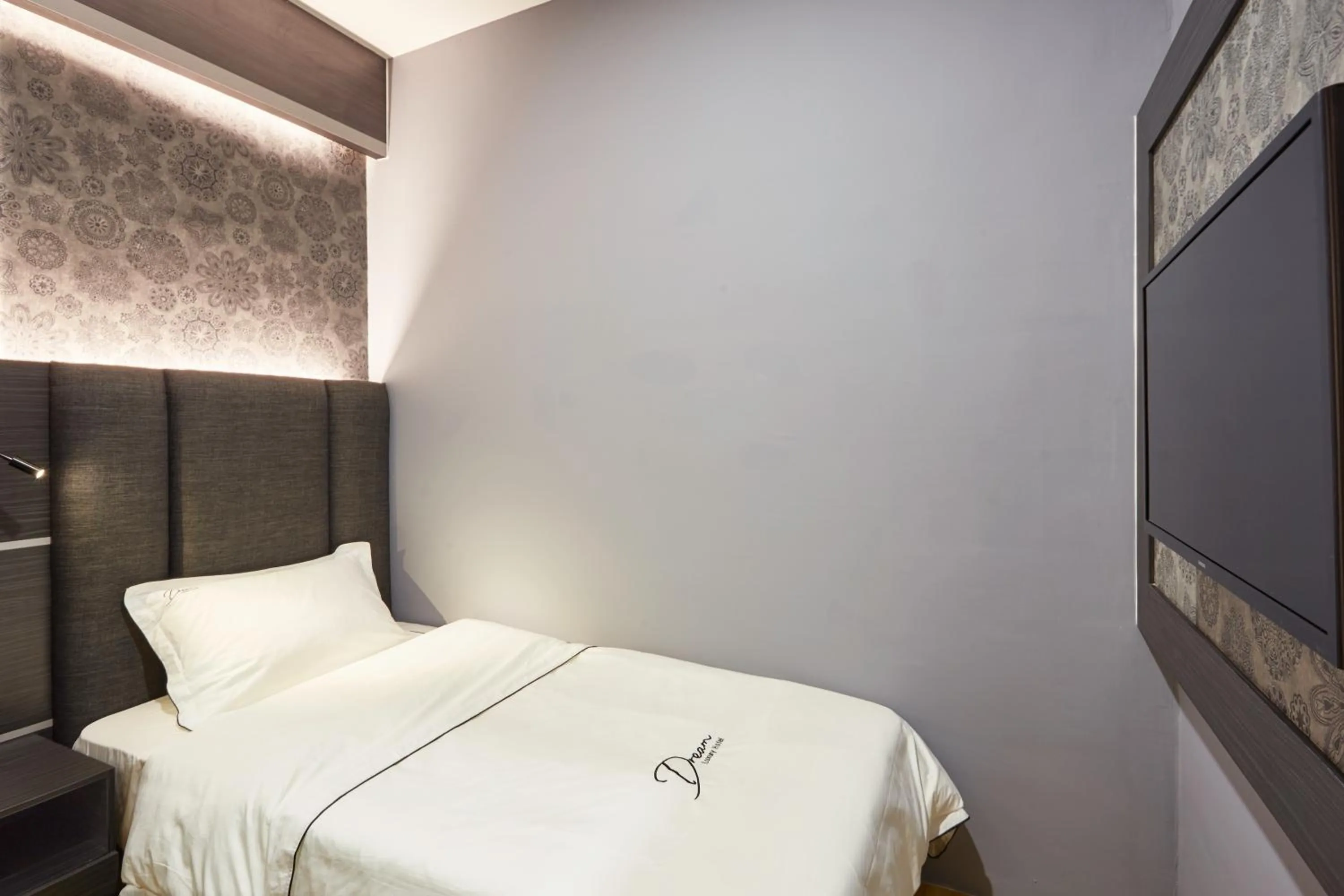 Bed in DREAM LUXURY HOTEL