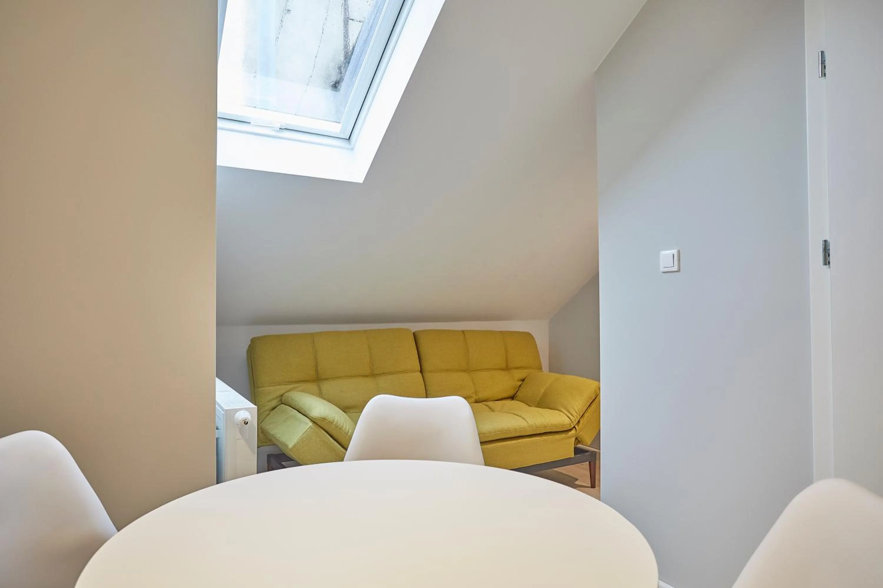 Seating area in FLORIANSKA 32 by PI Apartments