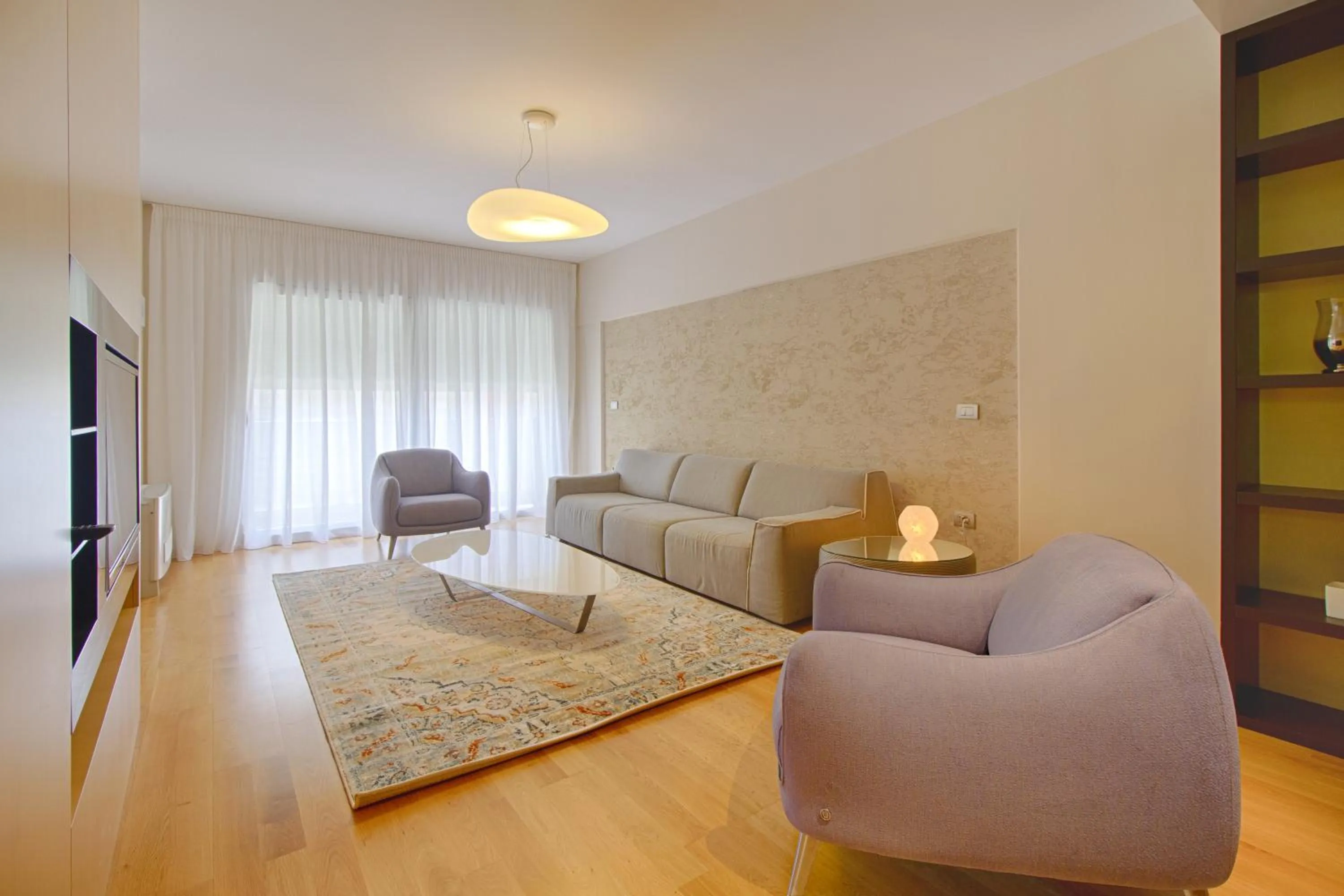 Communal lounge/ TV room in THE ROOMS - Serviced Apartments Tirana