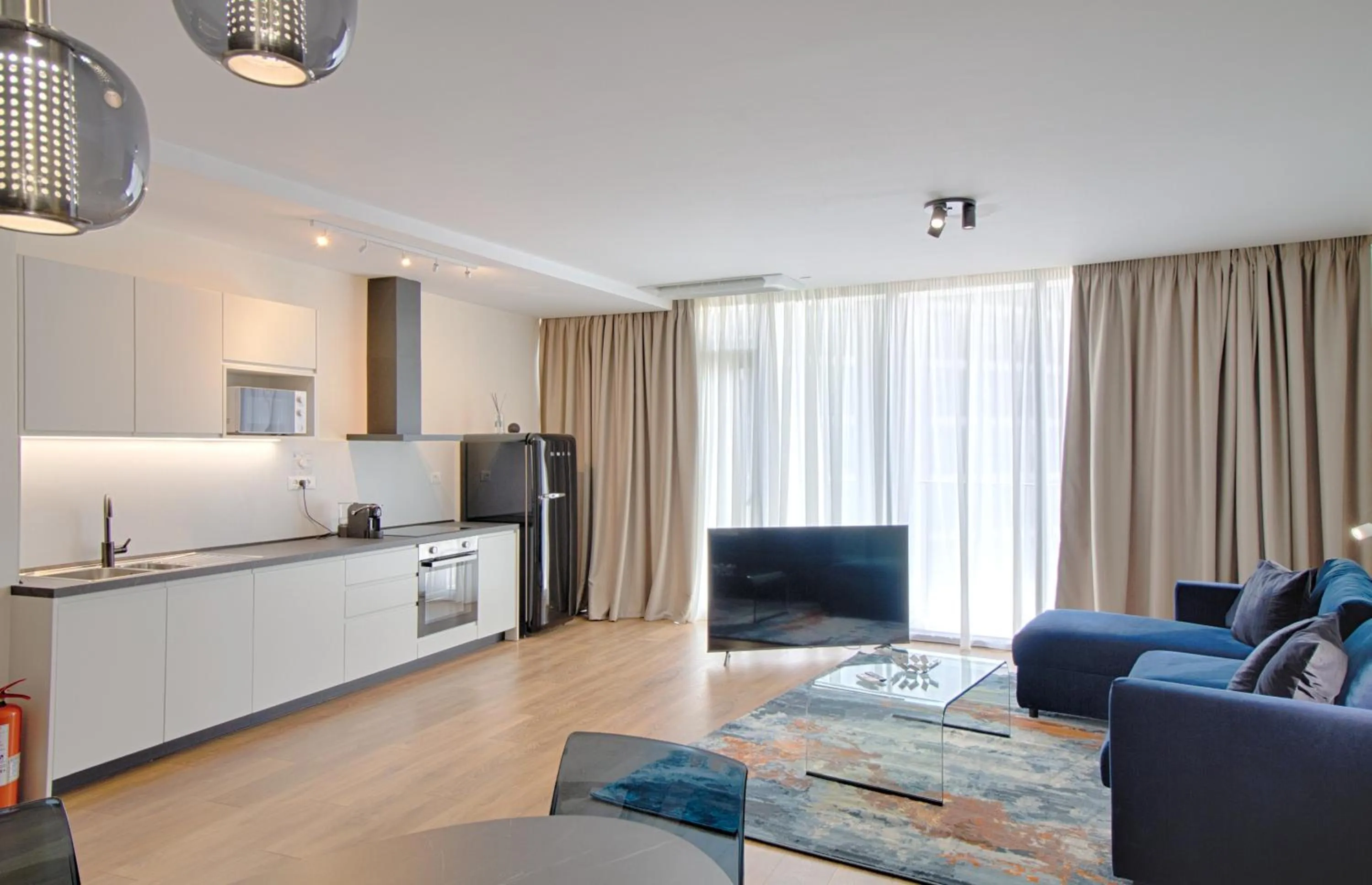 Communal lounge/ TV room in THE ROOMS - Serviced Apartments Tirana