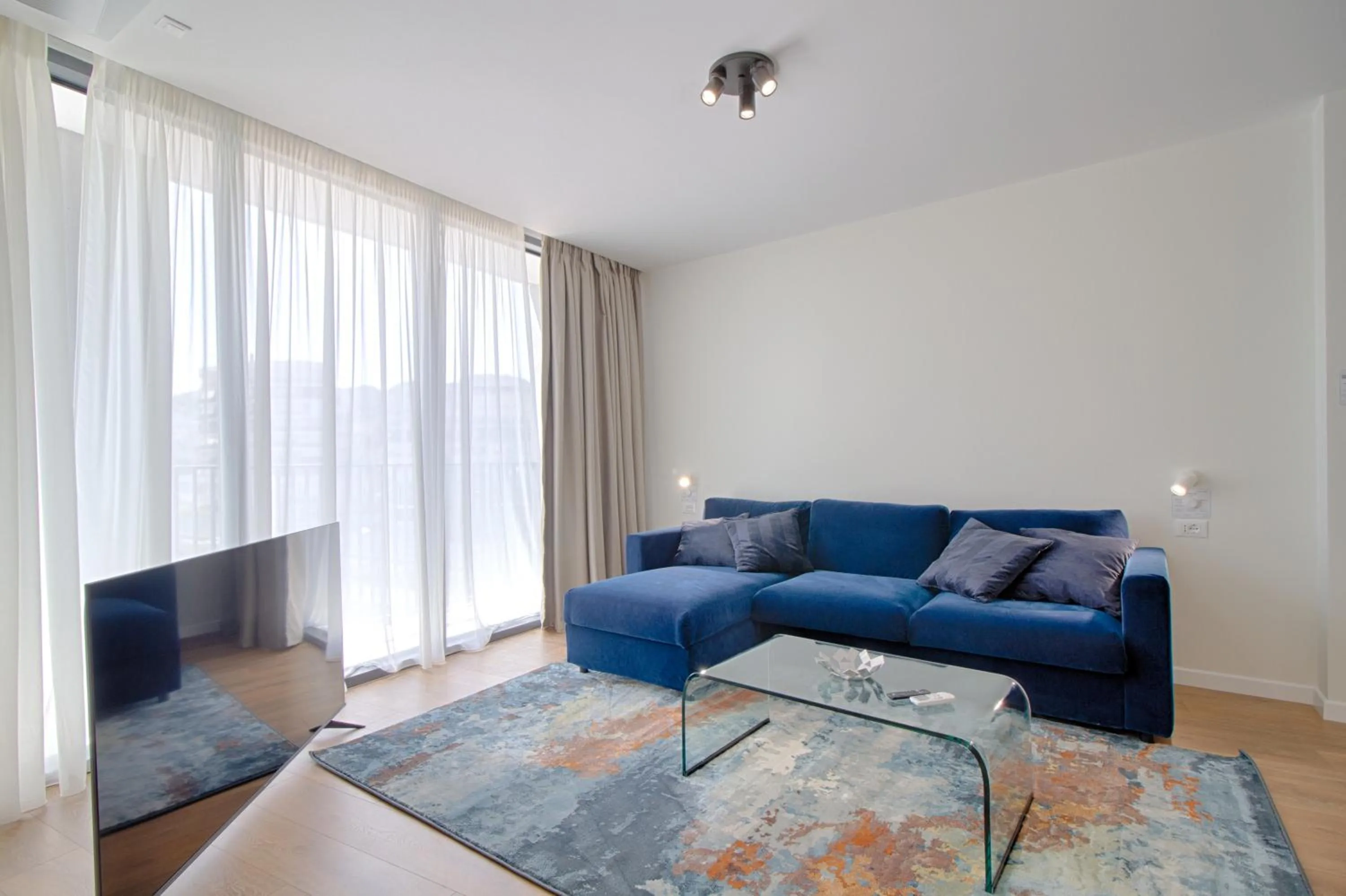 Communal lounge/ TV room in THE ROOMS - Serviced Apartments Tirana