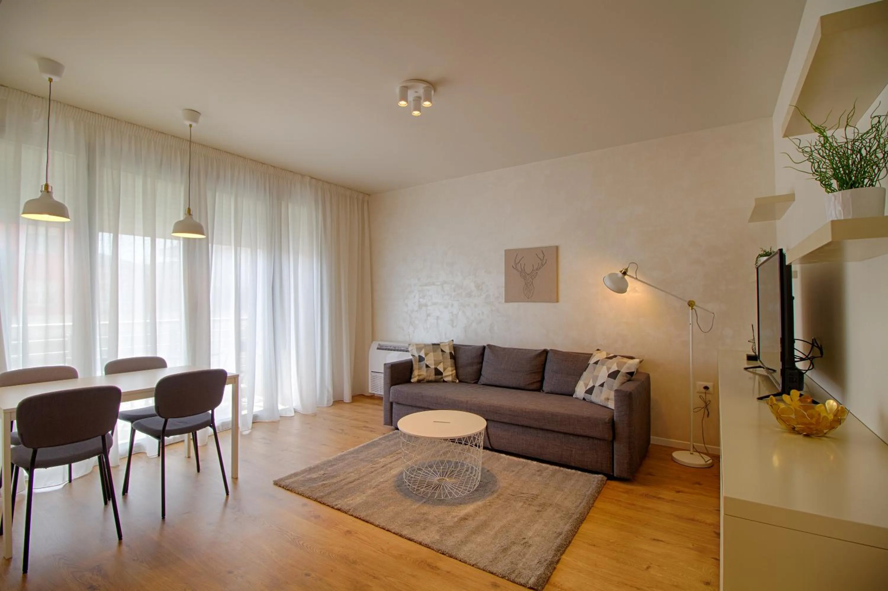 Communal lounge/ TV room in THE ROOMS - Serviced Apartments Tirana