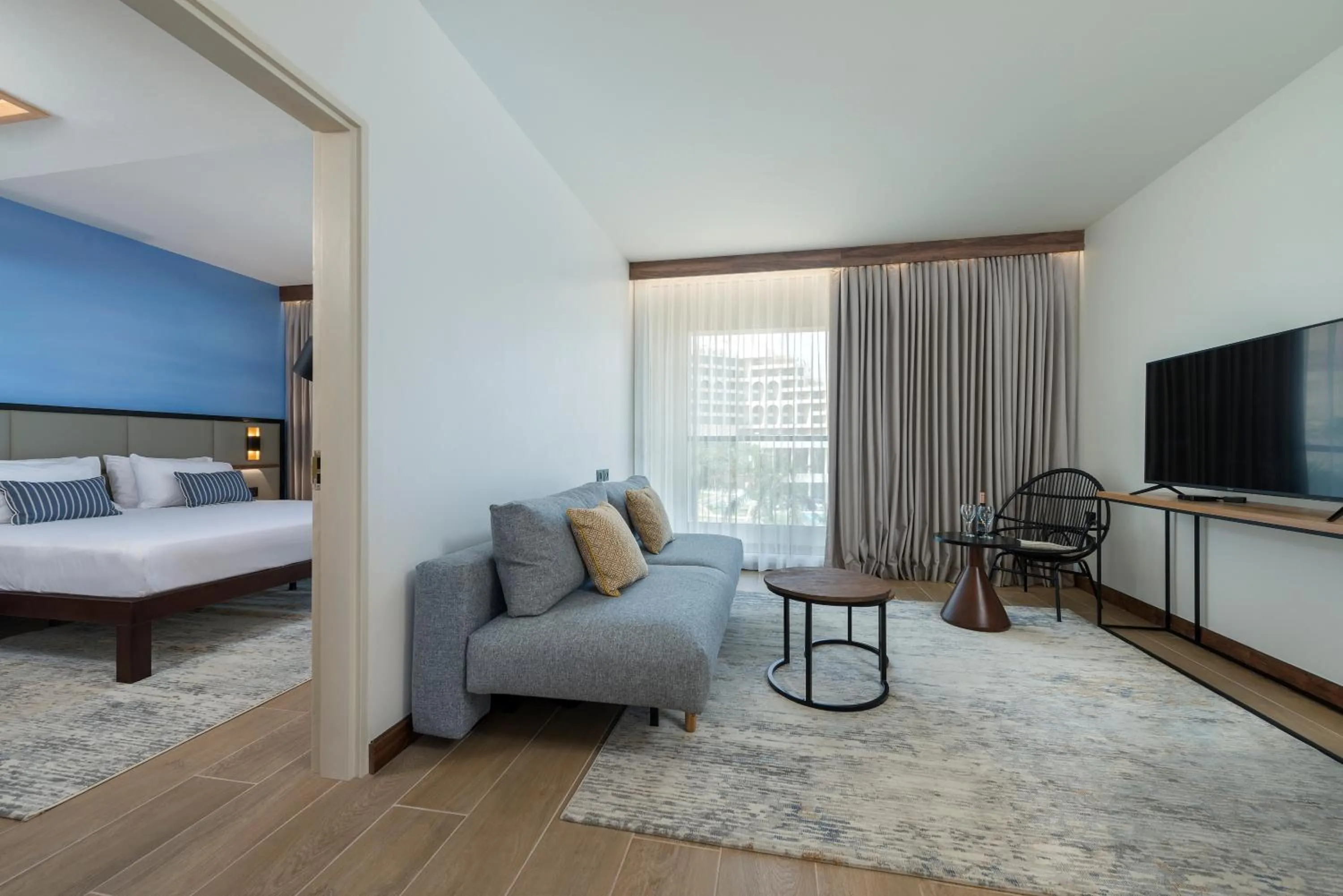 Living room, Bed in Nevo by Isrotel Collection