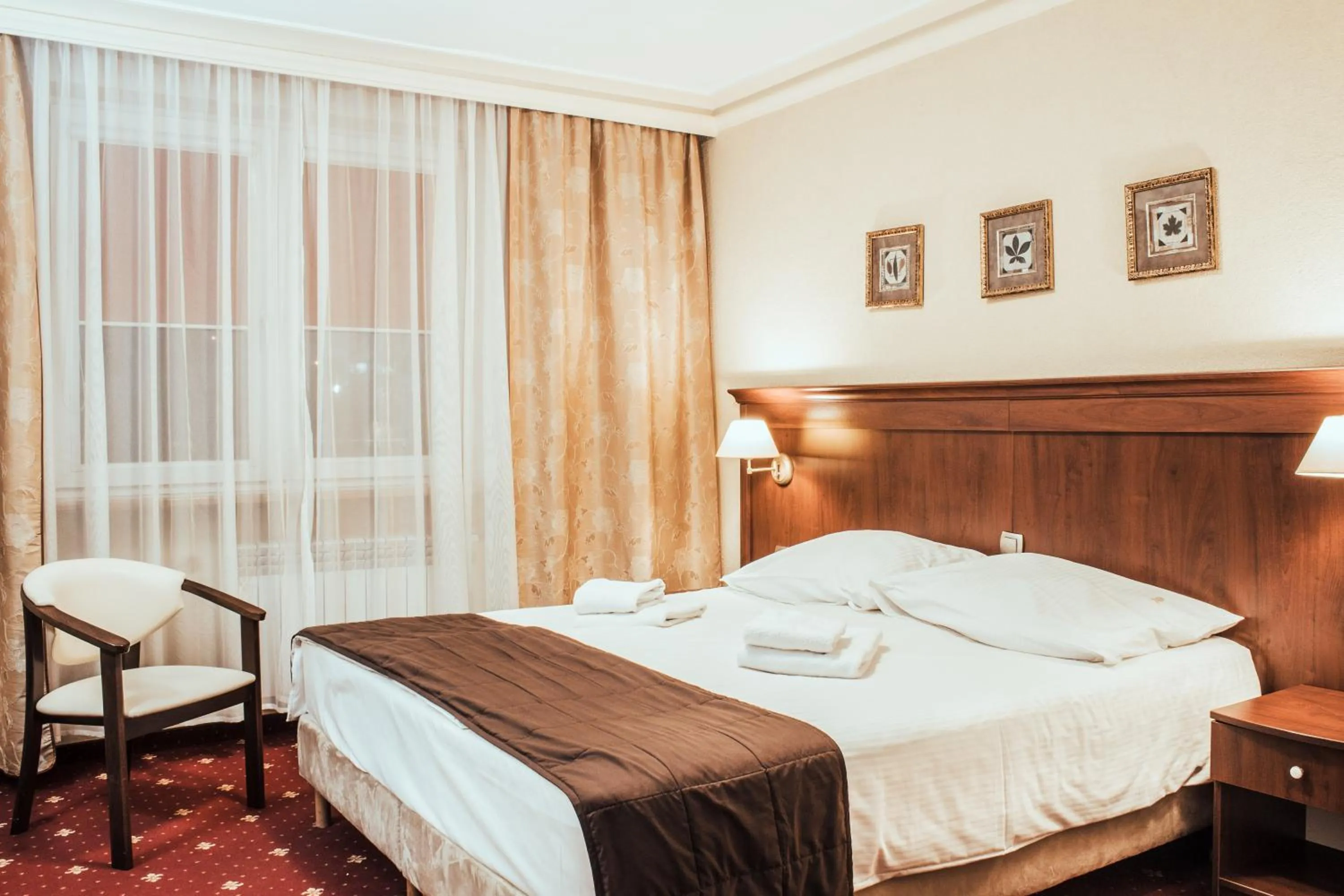 Bed in Cumulus Hotel