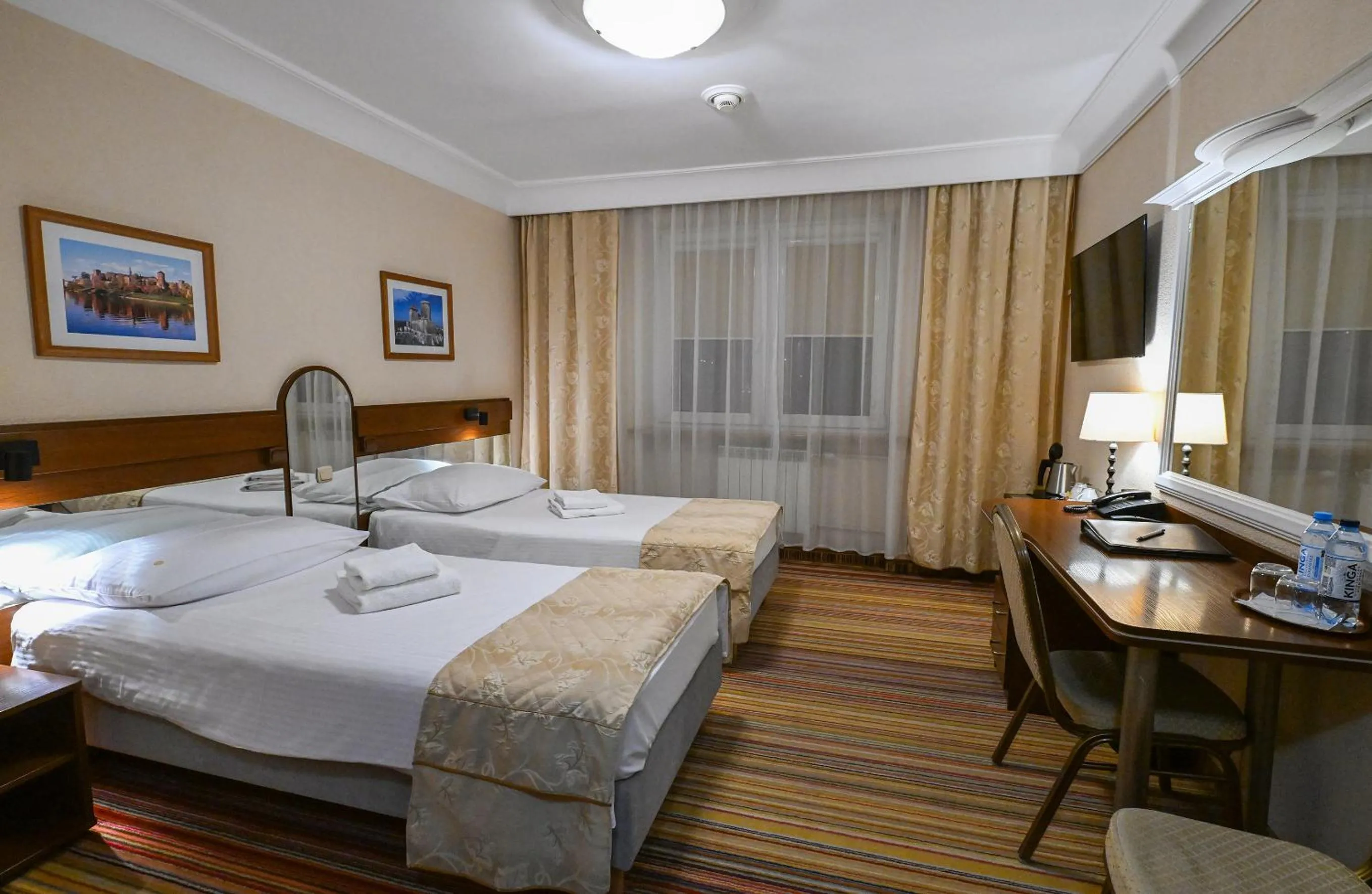 Bed in Cumulus Hotel