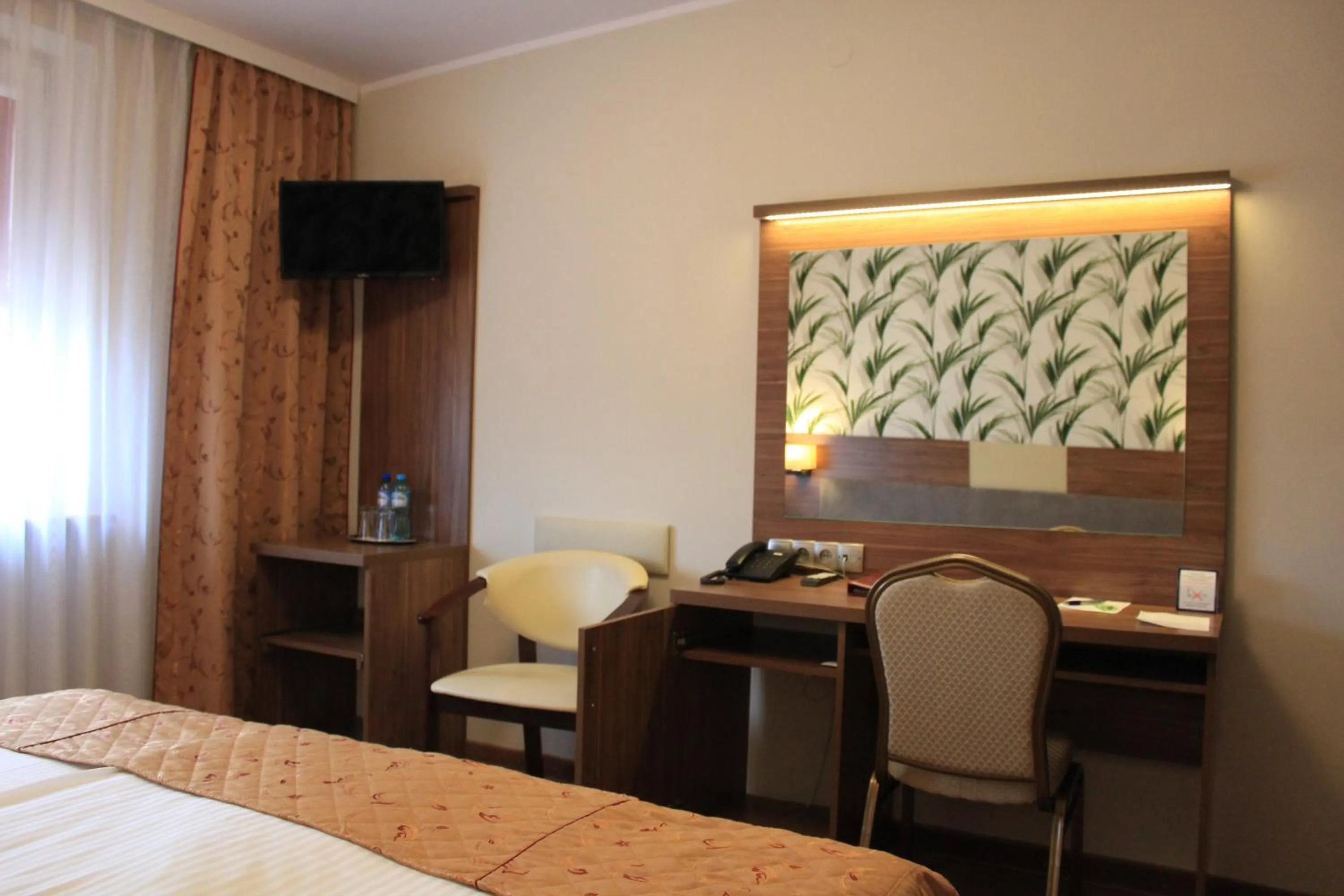 Bed in Cumulus Hotel