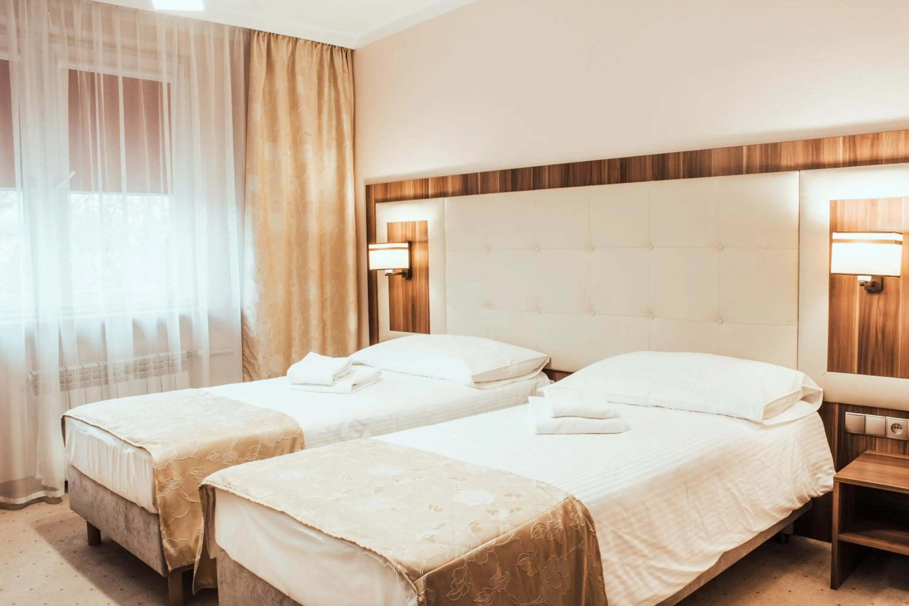 Bed in Cumulus Hotel